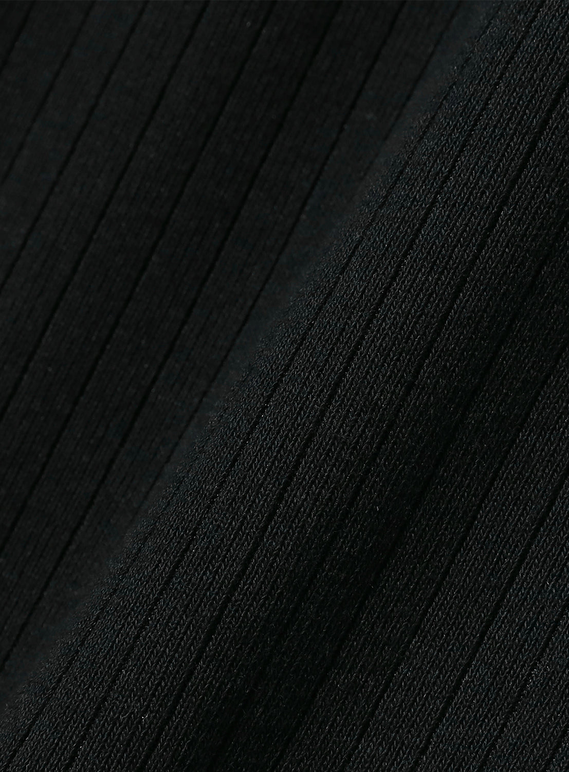 Close-up of black ribbed textured fabric.