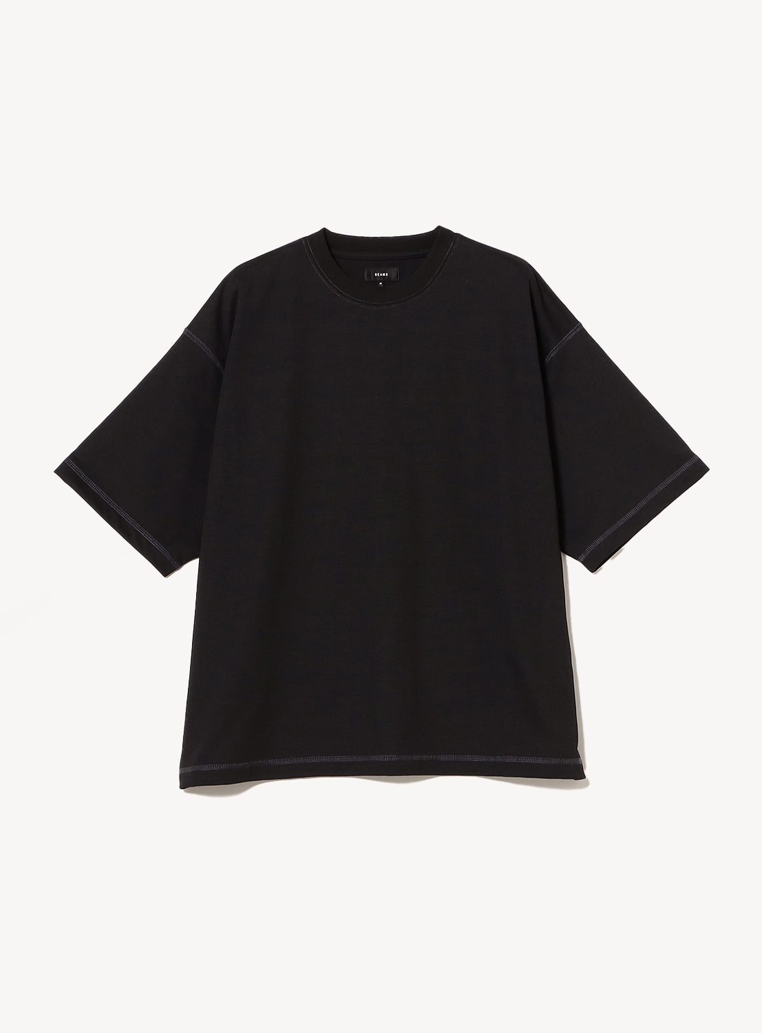 Black t-shirt with stitching details. 