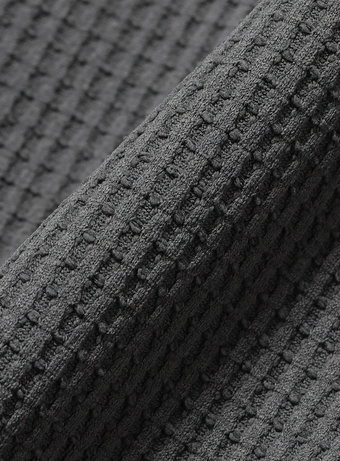 Close-up of a charcoal gray BEAMS Stretch Waffle T-shirt.