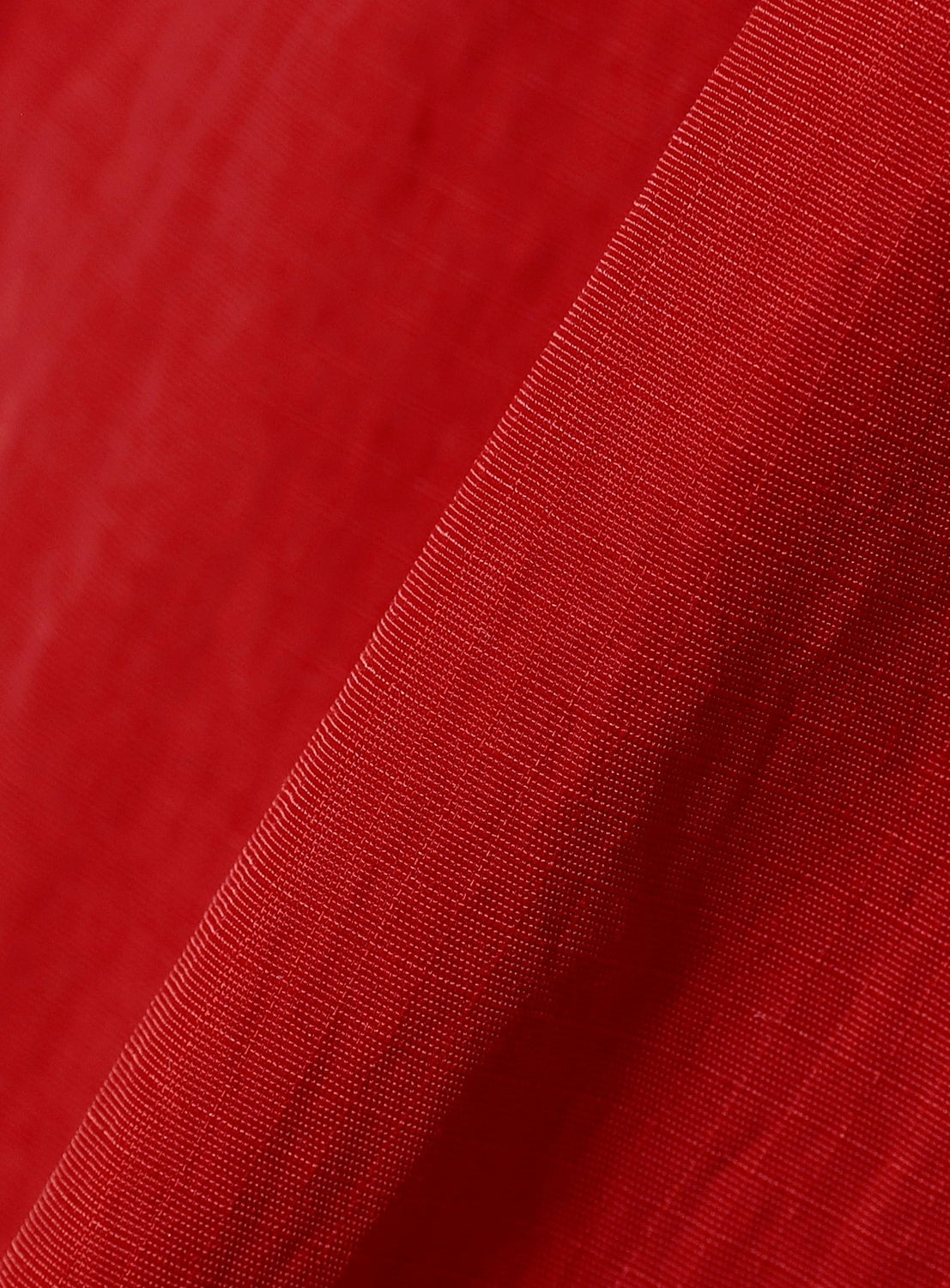 Close-up of red BEAMS BOY nylon packable hooded jacket showing texture and fold.