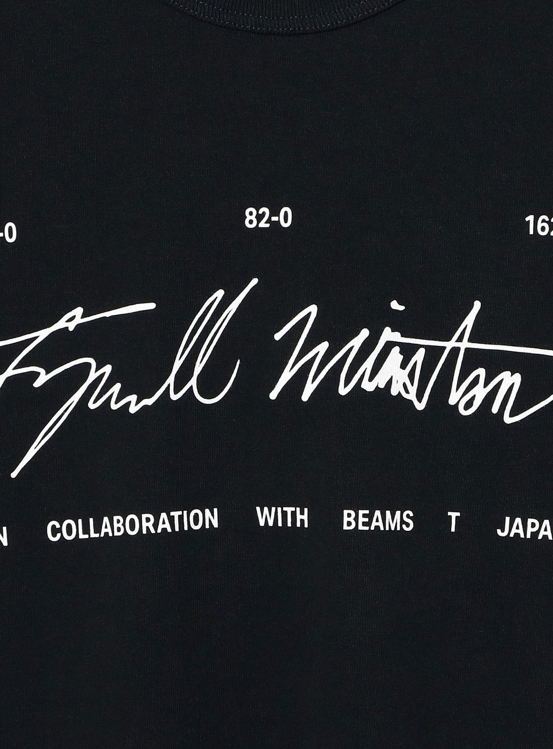 The BEAMS T Tyrrell Winston - Sign T-Shirt features a black base with bold, white handwritten-style text prominently centered on the front, framed above by the numbers 82-0 and 16-0. Below, smaller lettering states “IN COLLABORATION WITH BEAMS T JAPAN.” This exclusive collaboration combines street style and artistic influence in a standout piece.