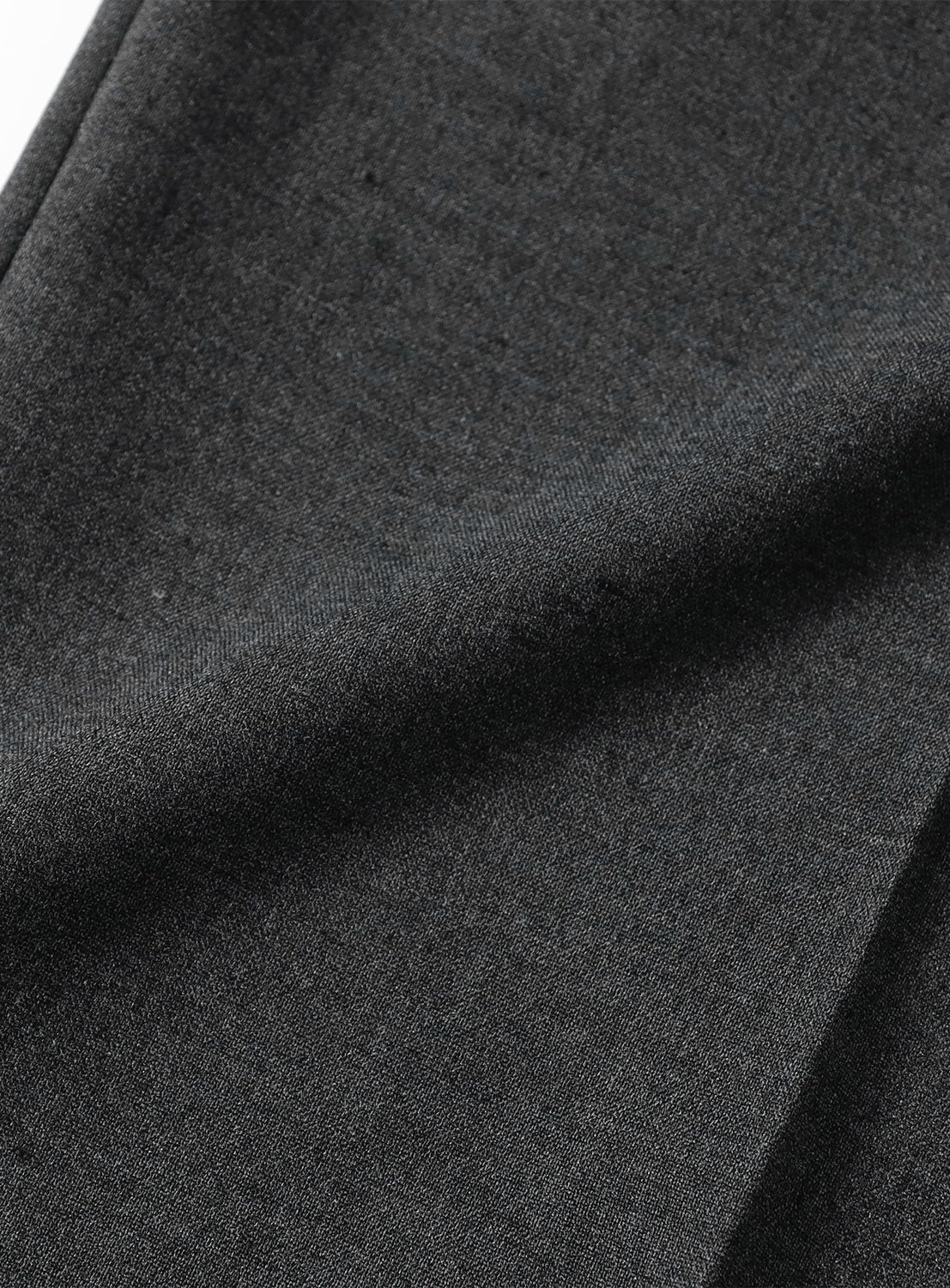 Close-up of the dark gray fabric of Easy-Wear Relaxed Fit Wide Slacks, featuring a wrinkle-resistant texture and a vertical crease.