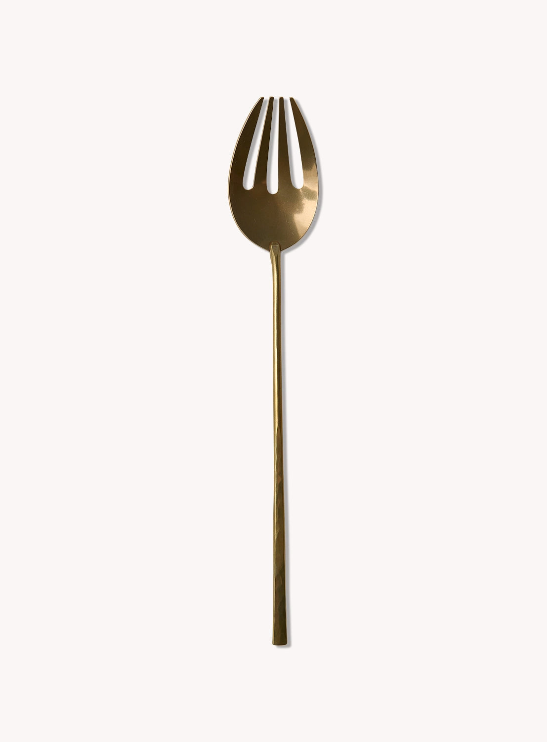 Gold-colored fork on a white background.