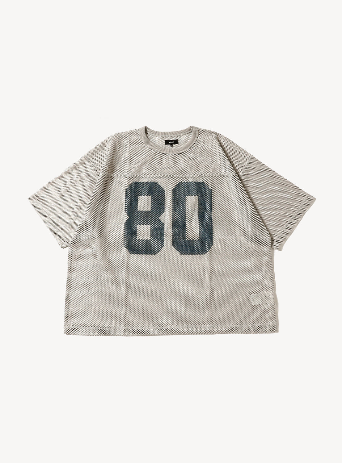 Beige mesh football jersey flat lay, featuring large dark "80" numbers on the front.