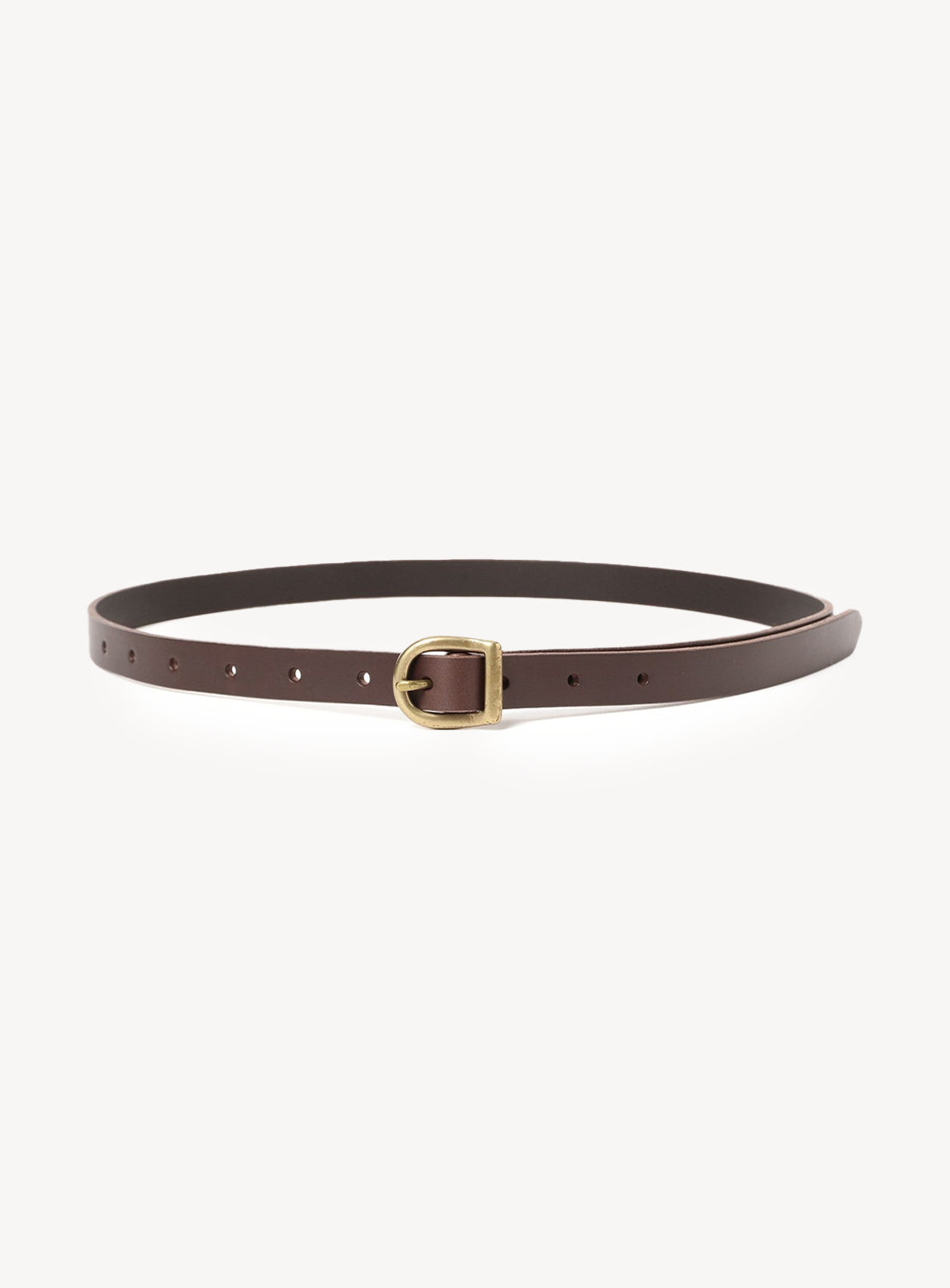 The Arc Belt by Hender Scheme is a slim genuine leather belt with a small gold buckle, shown in a circular shape on a plain white background.