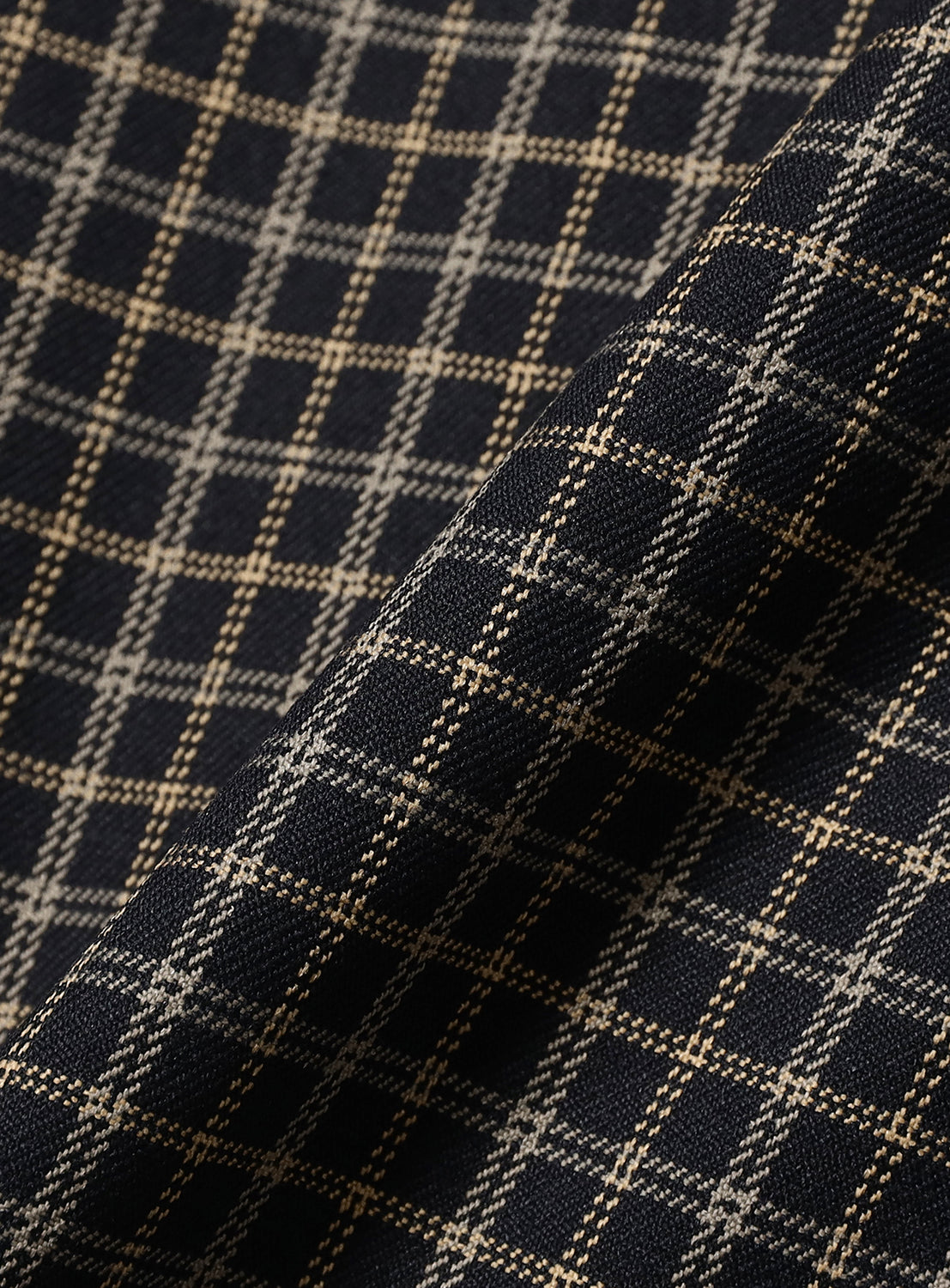 Close-up of navy fabric with a tan and black grid pattern on these BEAMS Pattern 6-Pocket Pants in a relaxed cargo fit.