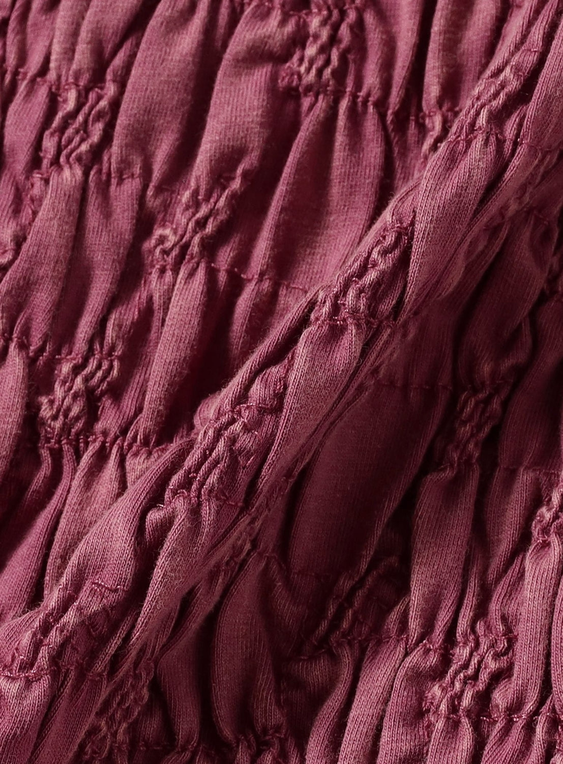 Close-up of textured burgundy fabric