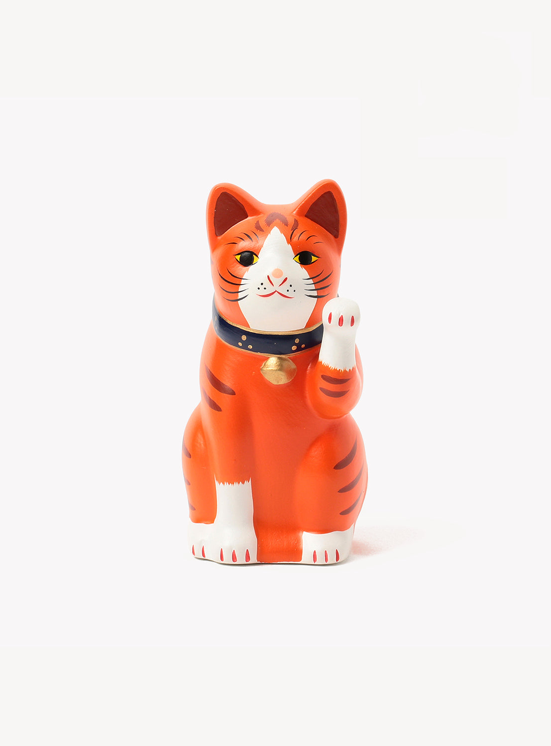 Orange cat-shaped figurine with a white belly on a white background