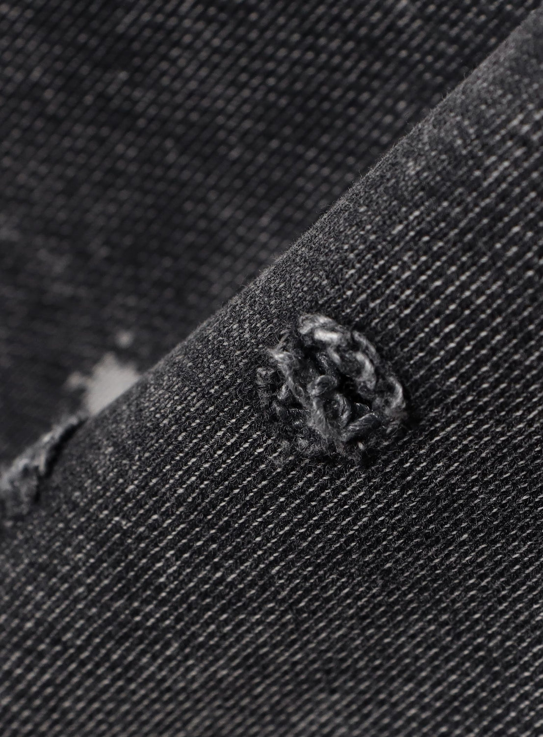 Close-up of BEAMS Distressed Wide Straight Fit Sweatpants in dark gray, showing hand-sewn repair stitches over a tear and a folded edge. The heavyweight fabric’s weave and individual threads are clearly visible.