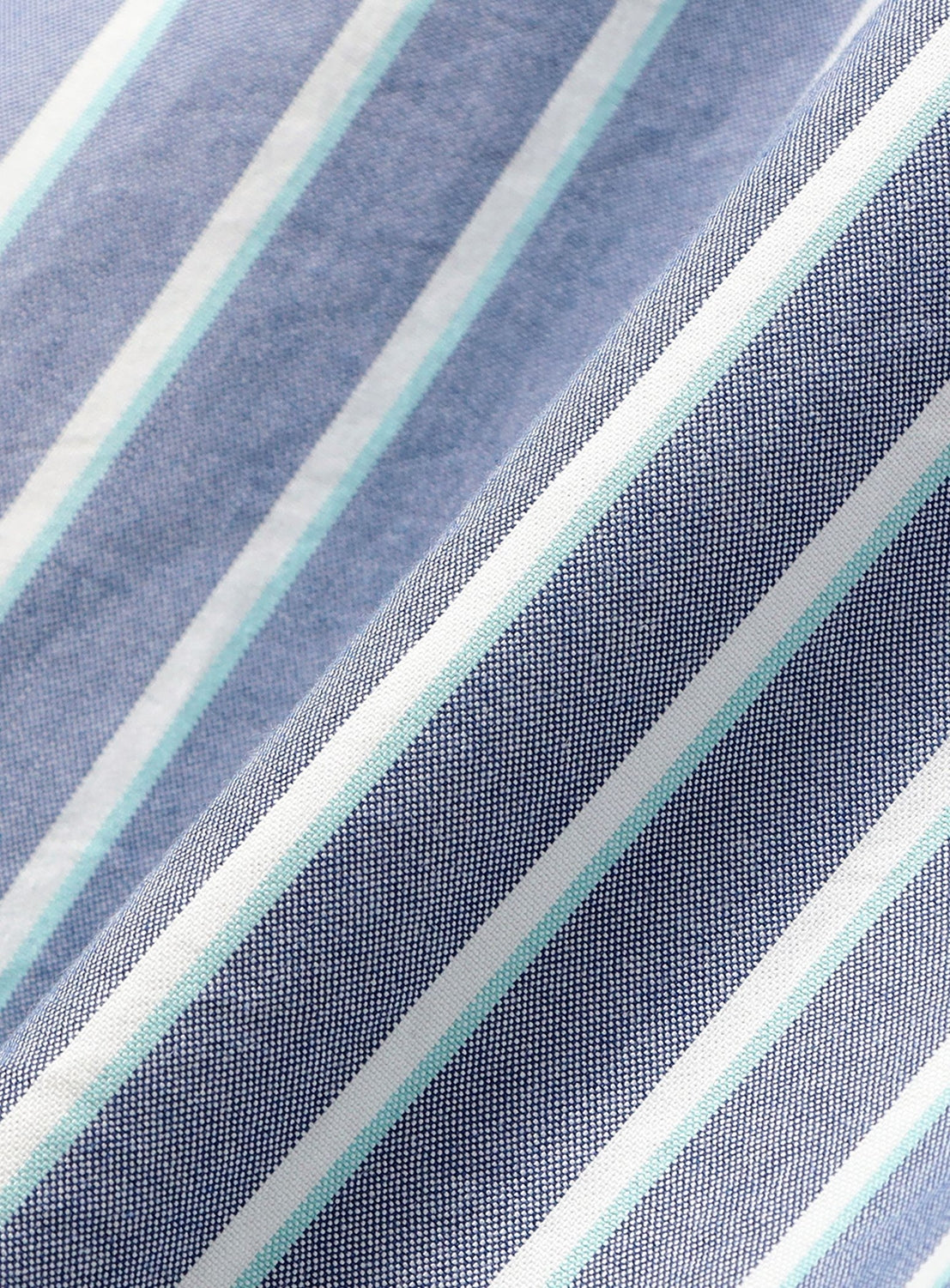 Close-up of a BEAMS Heavy Oxford Button-Down Shirt in a blue, white, and light green vertical striped fabric.