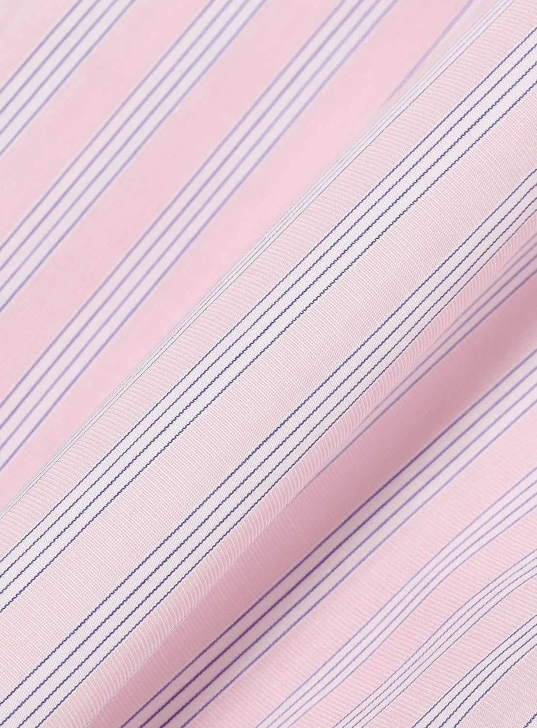 Close-up of pink fabric with diagonal thin blue and white stripes from the TTT MSW I Love My Dog Half Sleeve Shirt. The fabric appears slightly textured and softly folded, creating shadows and highlights across the surface.