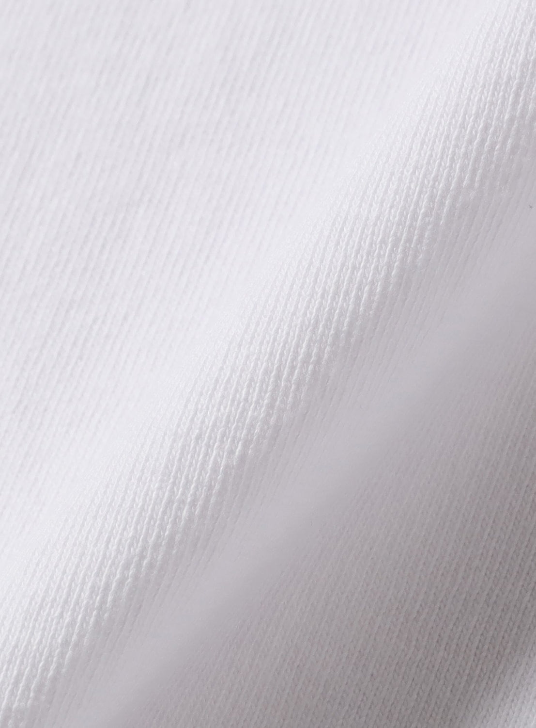Close-up of a textured white fabric surface