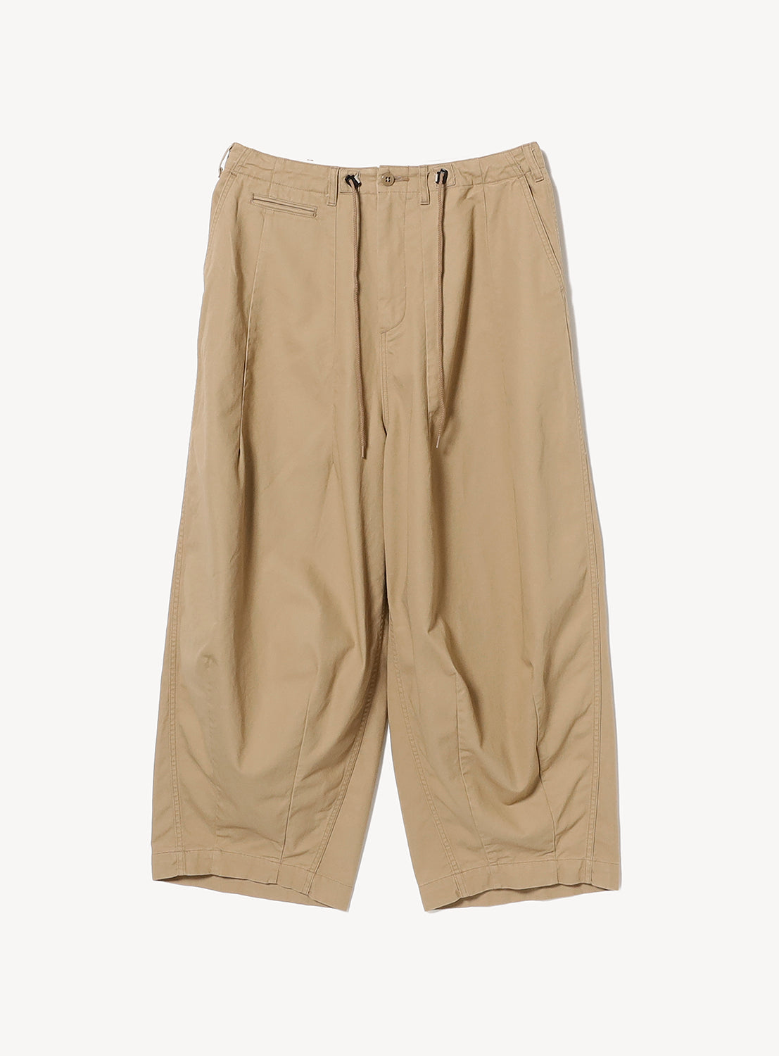 Front view of beige wide-leg chino pants featuring NEEDLES' signature H.D. silhouette. Designed with a button closure, adjustable drawstring waistband, side pockets, and sculptural darting at the waist and hem that creates a distinctive rounded, voluminous shape.