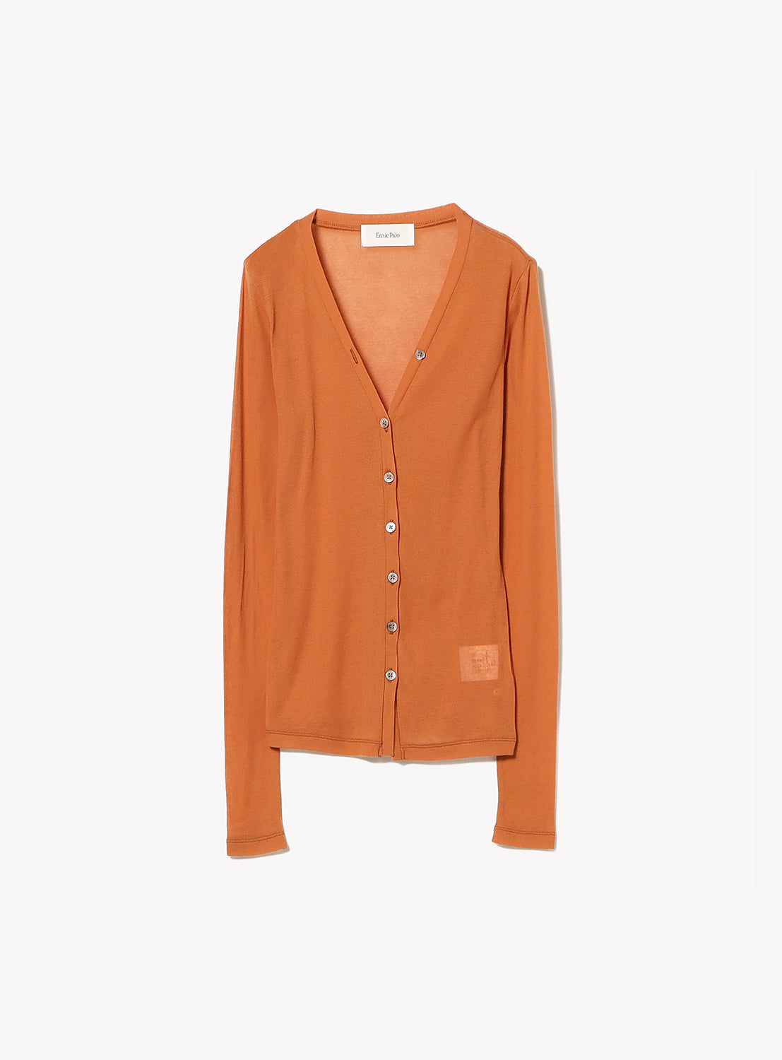 The Ernie Palo Sheer V-Neck Cardigan is a rust-colored, long-sleeve layering piece featuring a simple button-down front and minimalist design. Crafted from lightweight cotton for maximum comfort and ease, the cardigan is displayed against a plain white background.