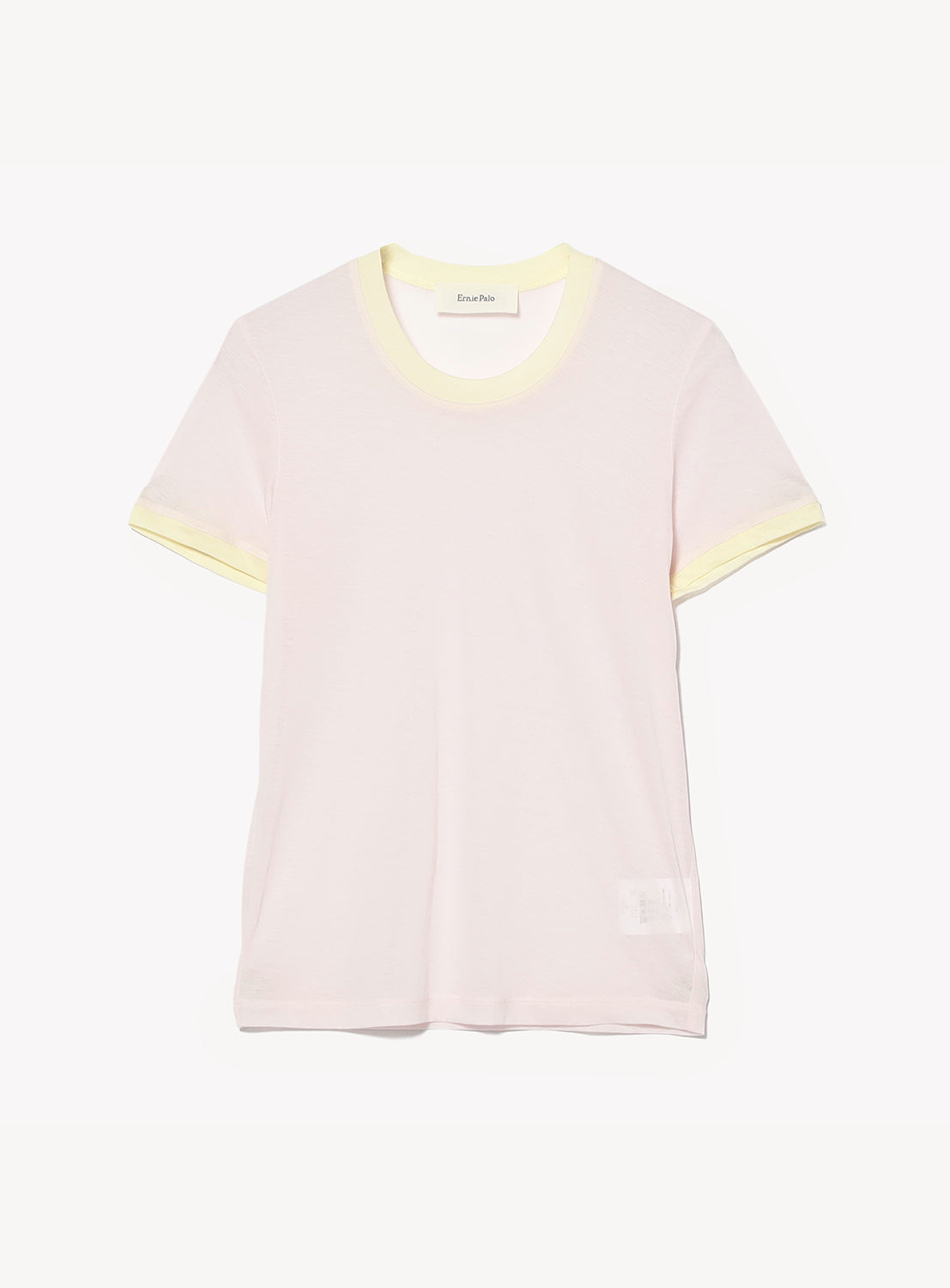 The Ernie Palo Ringer T-shirt, in light pink with pale yellow trim on the collar and cuffs, made from a soft cotton-nylon blend, is shown against a plain white background.