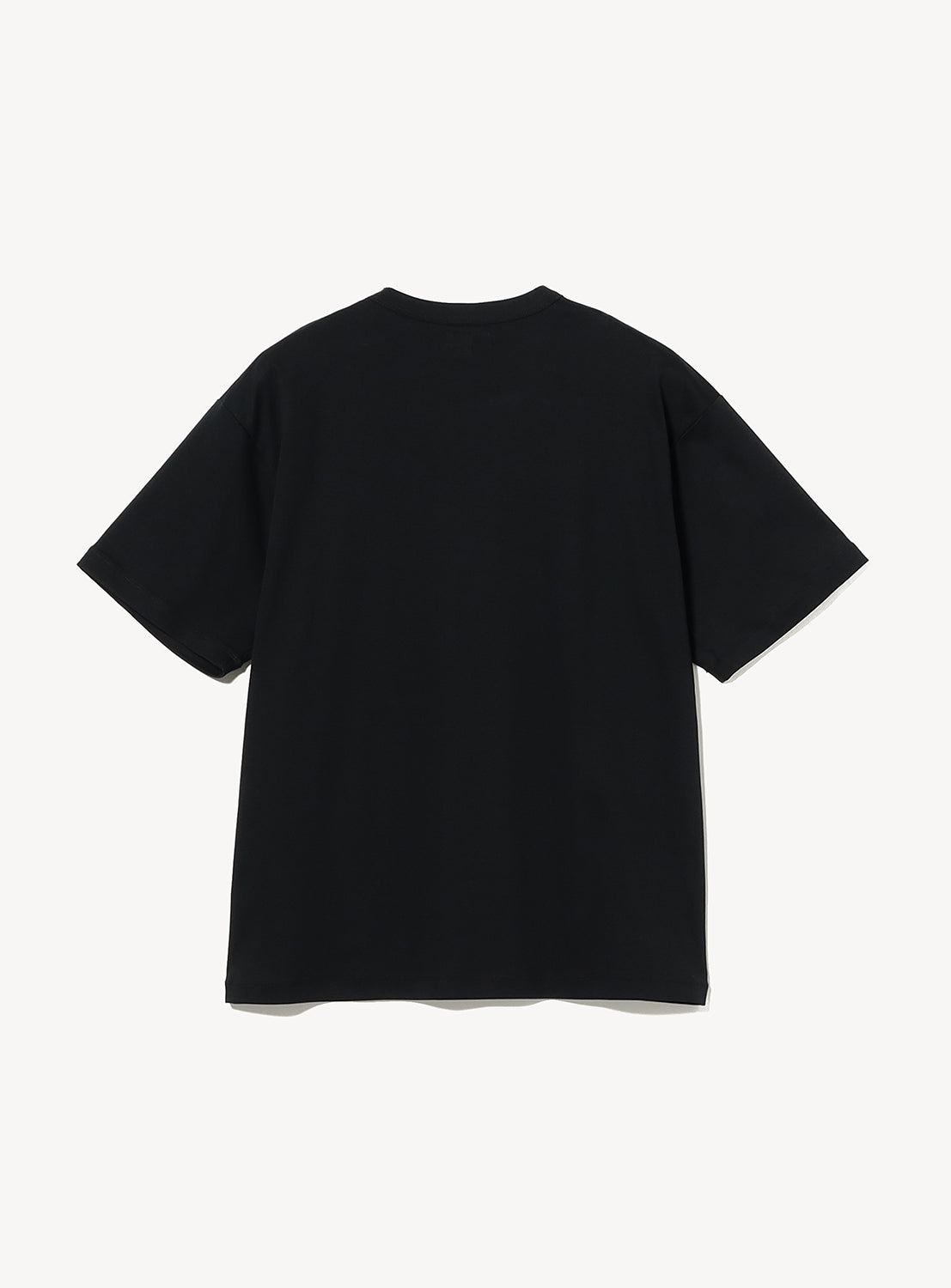 Black t-shirt with a decorative heart design on a white background