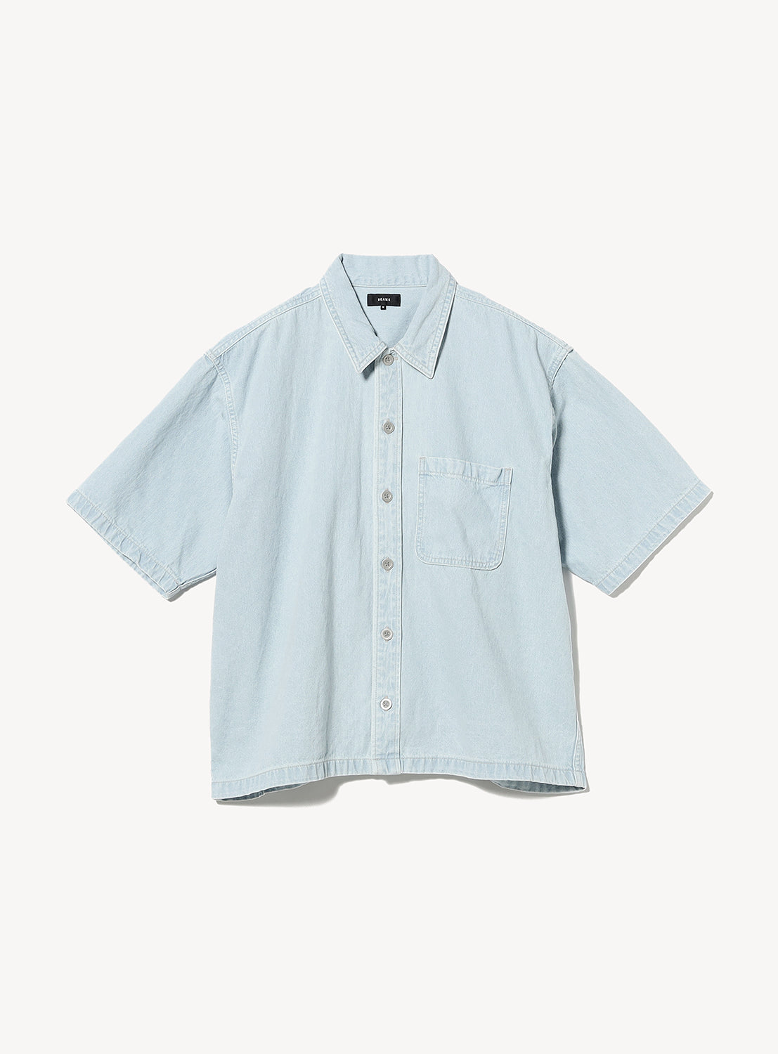Light blue denim shirt on a white background