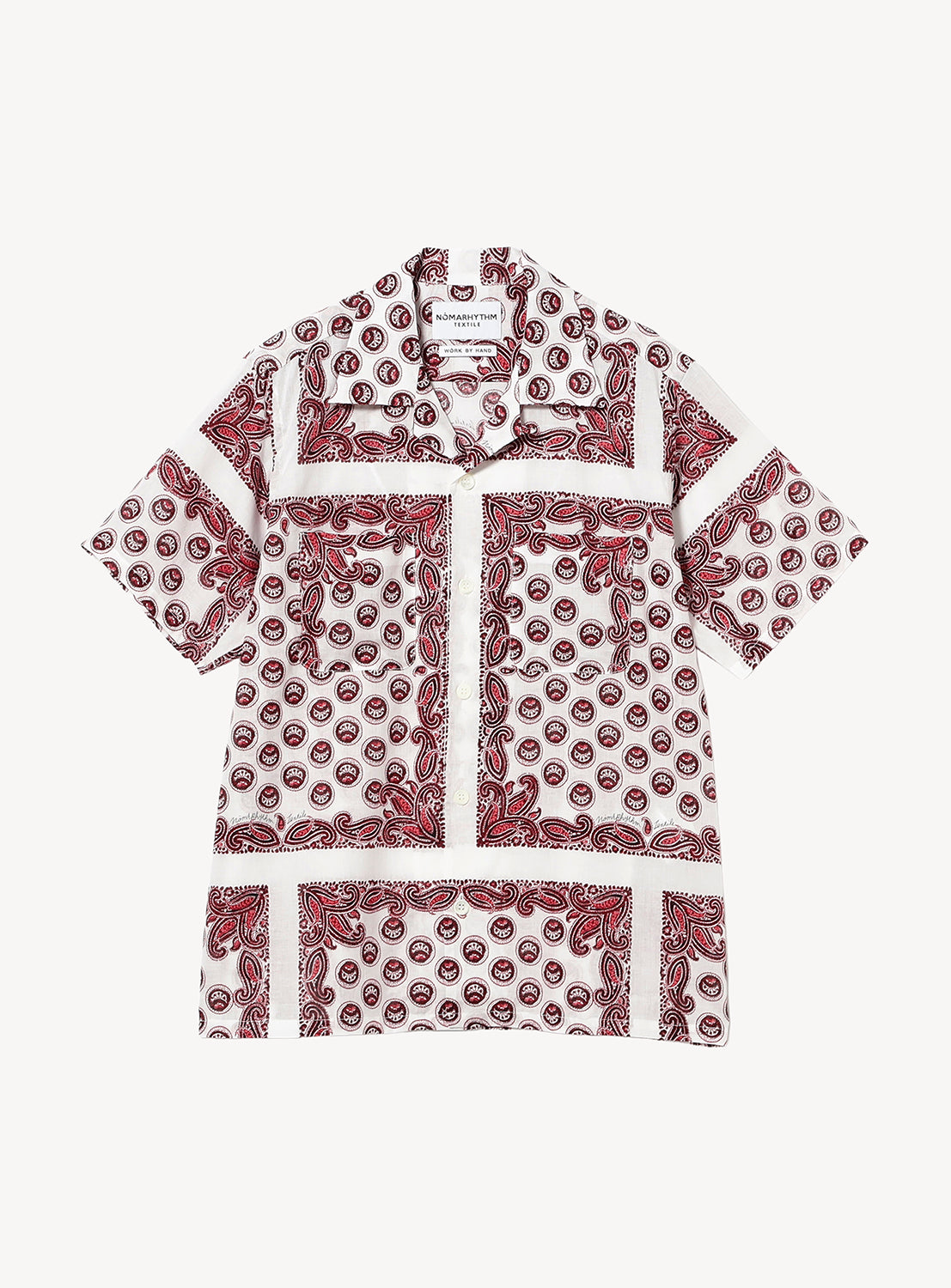 The Paisley Open Collar Shirt by NOMARHYTHM TEXTILE is a short-sleeve button-up featuring a red and black paisley print with geometric patterns on a white background. It has an open classic collar and offers a relaxed fit.