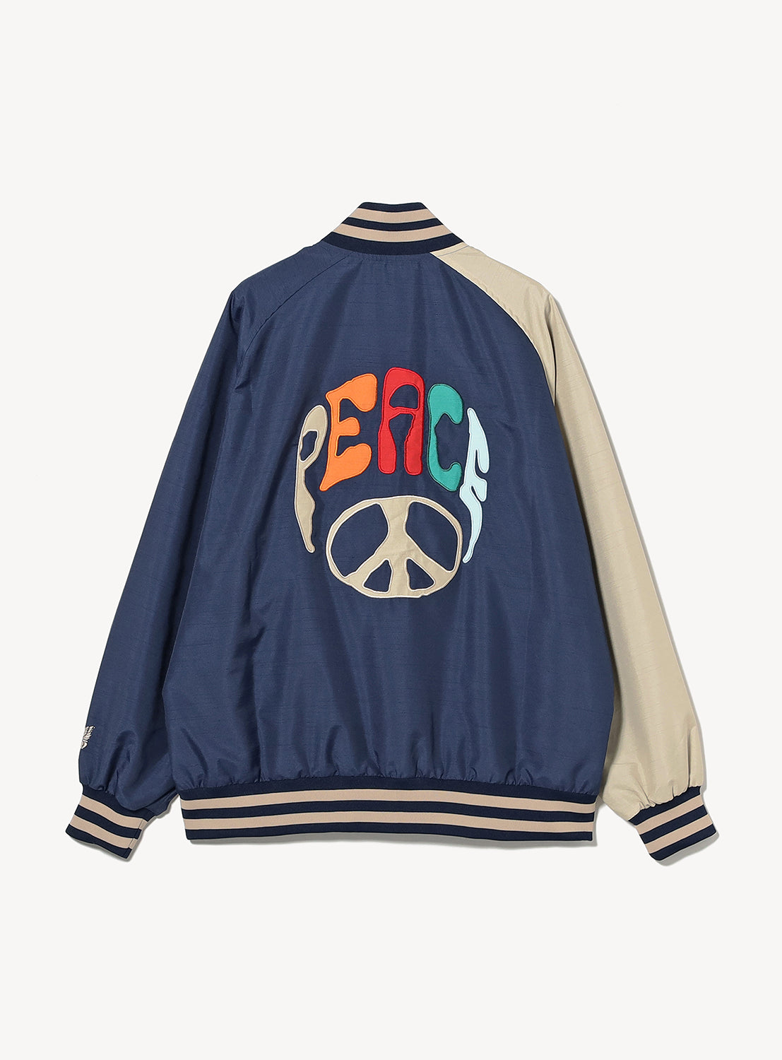 Navy blue jacket with 'PEACE' and peace symbol design on a white background