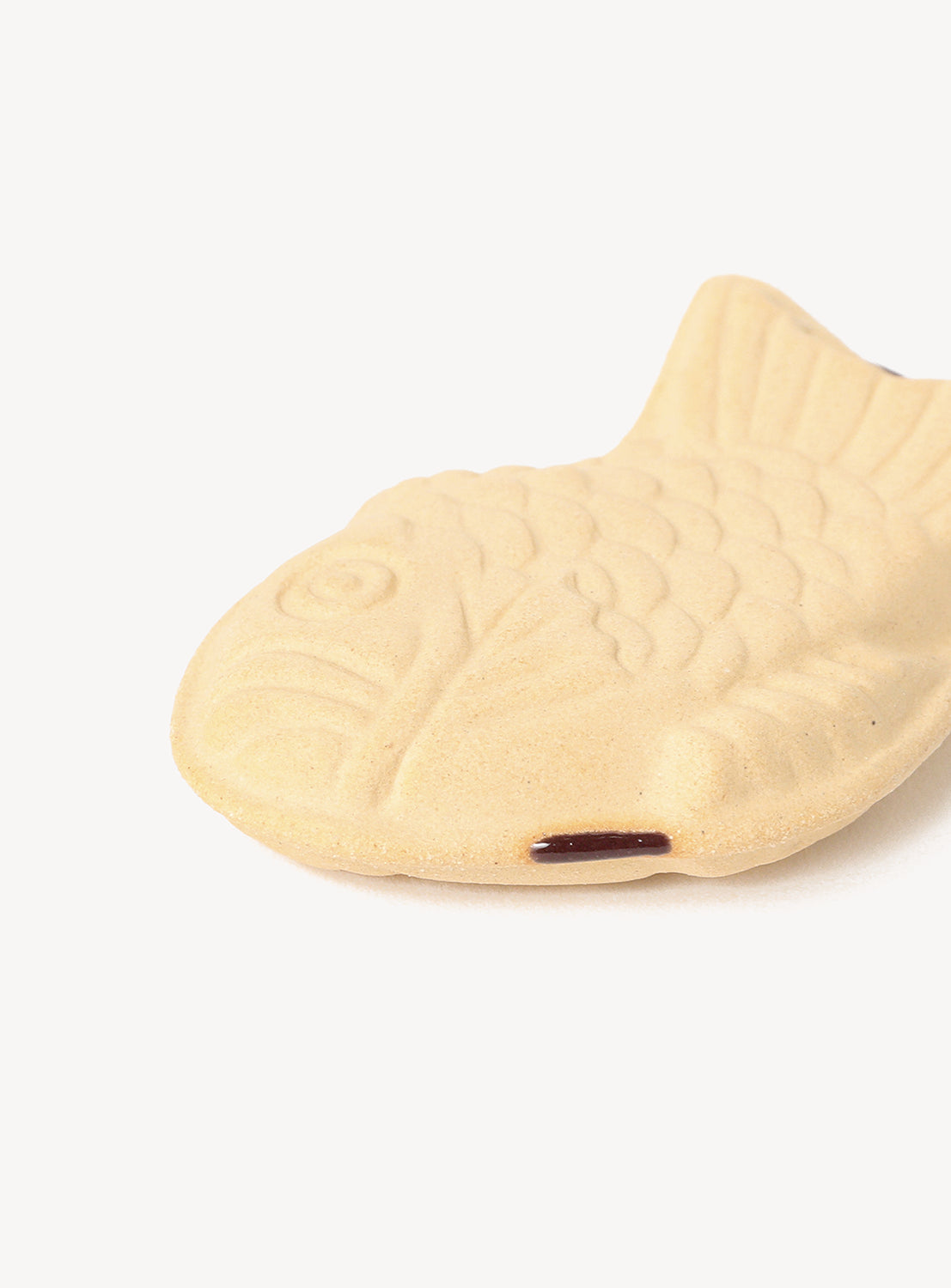 Fish-shaped chopstick rest on a white background