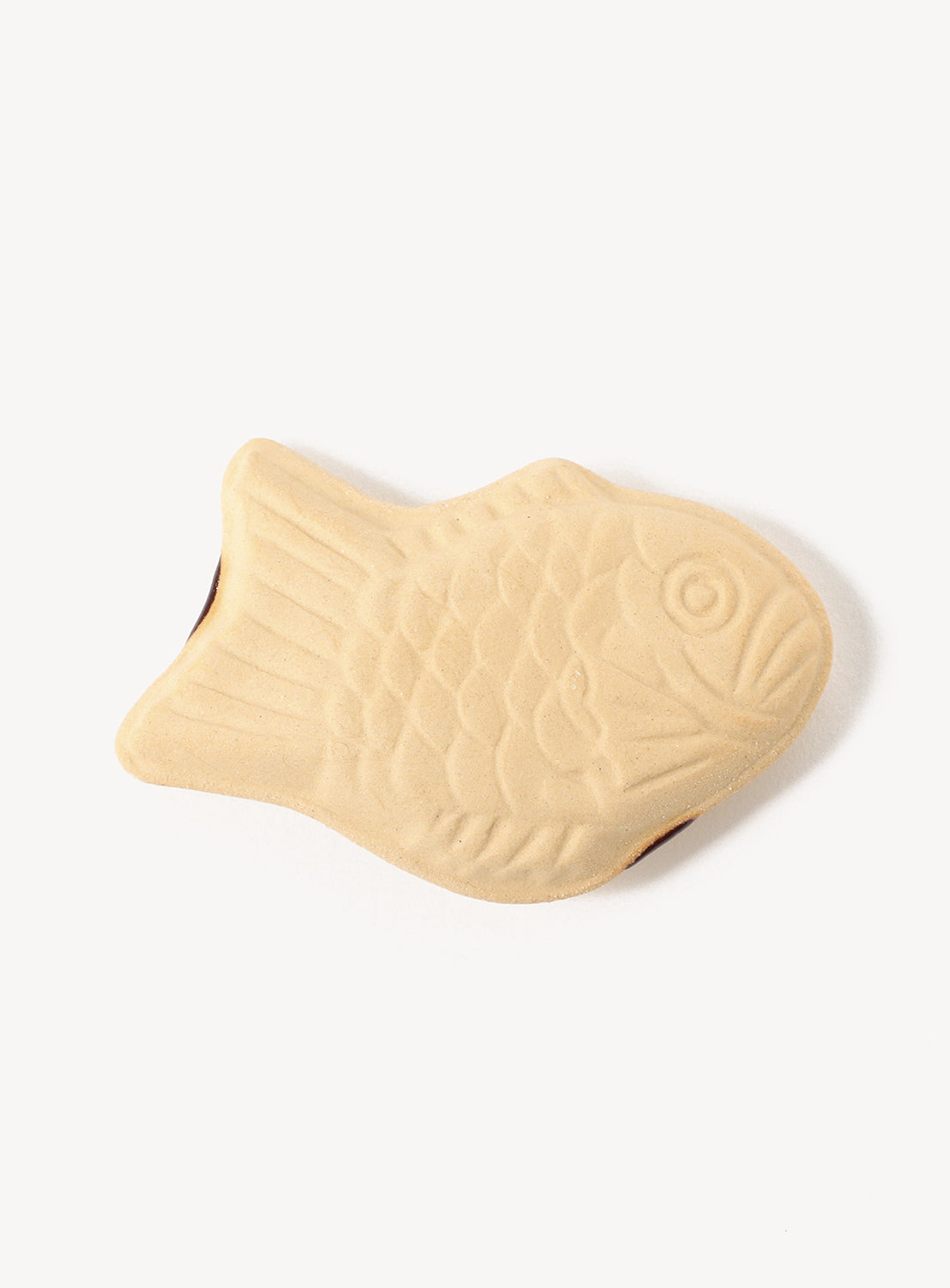 Fish-shaped chopstick rest on a white background