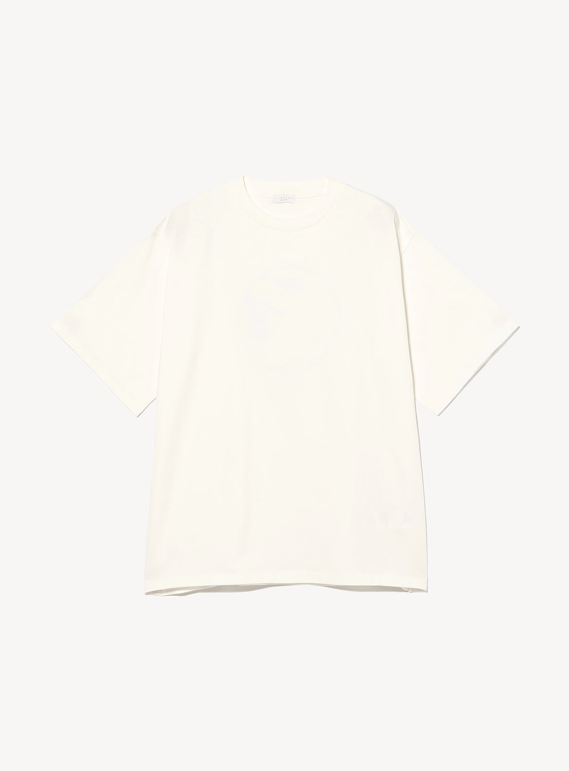 The F-LAGSTUF-F Symbol Logo Tee is a plain white, short-sleeved T-shirt with a classic crew neck and relaxed fit. It features a subtle pigment-dye finish for a vintage-inspired look and is laid flat on a white background, with no visible logos or designs on the front.