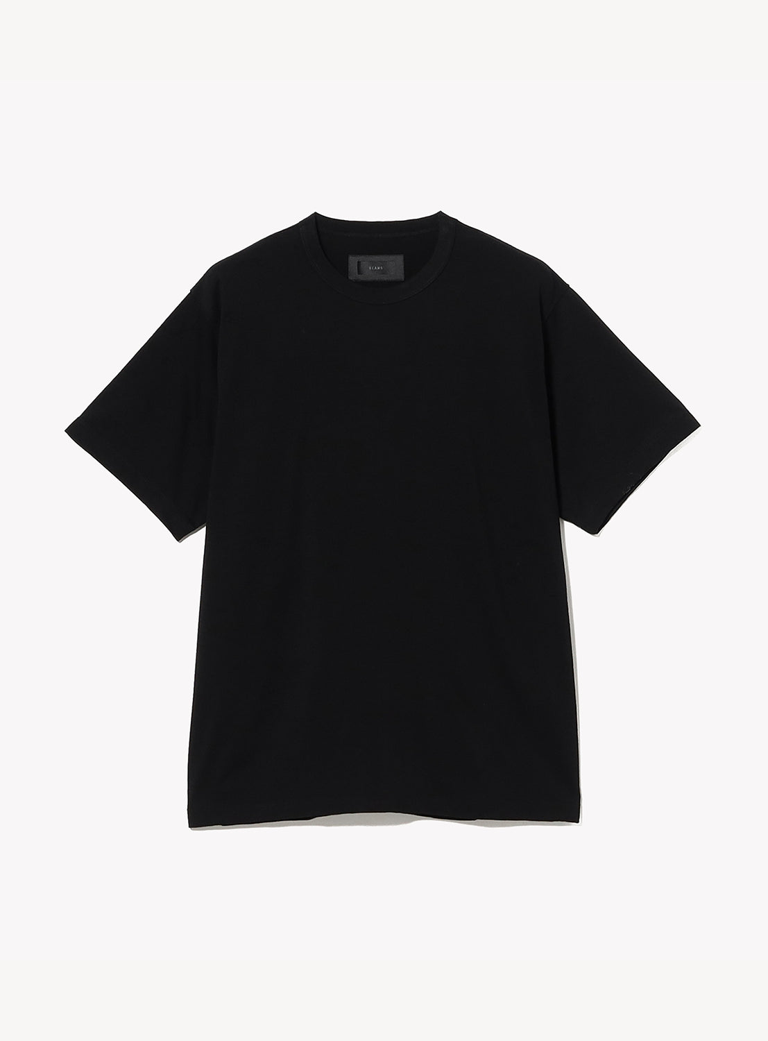The BEAMS "the A - Washable Merino Wool T-Shirt" in plain black, featuring half sleeves, a crew neckline, and a relaxed fit, is shown laid flat on a white background with no visible designs or logos.