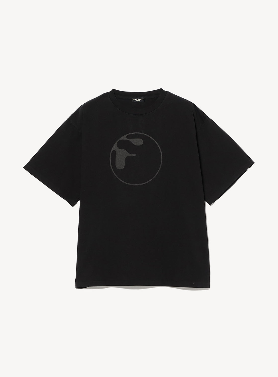 The F-LAGSTUF-F Symbol Logo Tee is a black heavyweight cotton short-sleeve T-shirt with a minimalist dark gray globe design on the chest, shown against a plain white background.