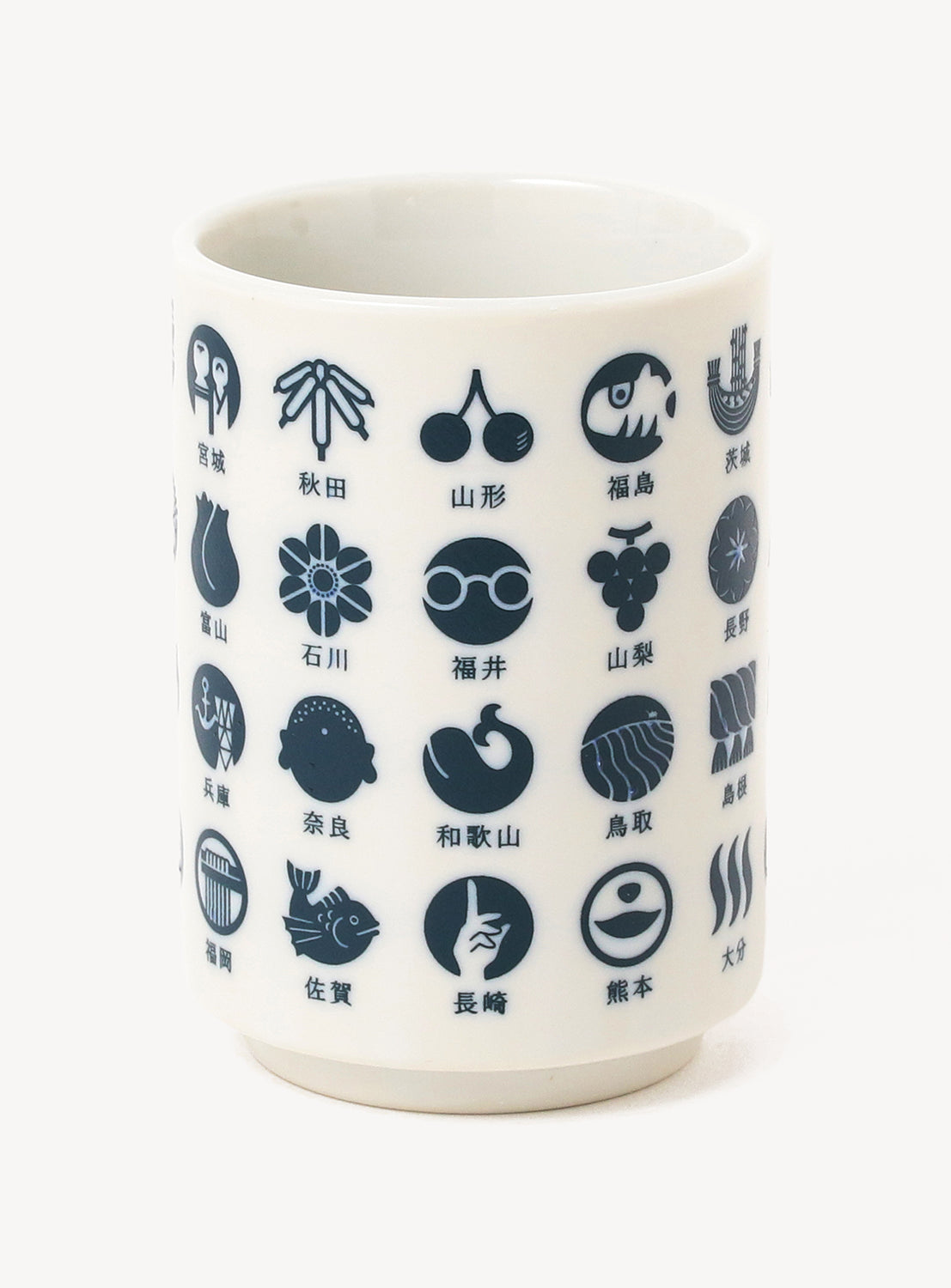White mug with navy geometric and icon patterns on a white background