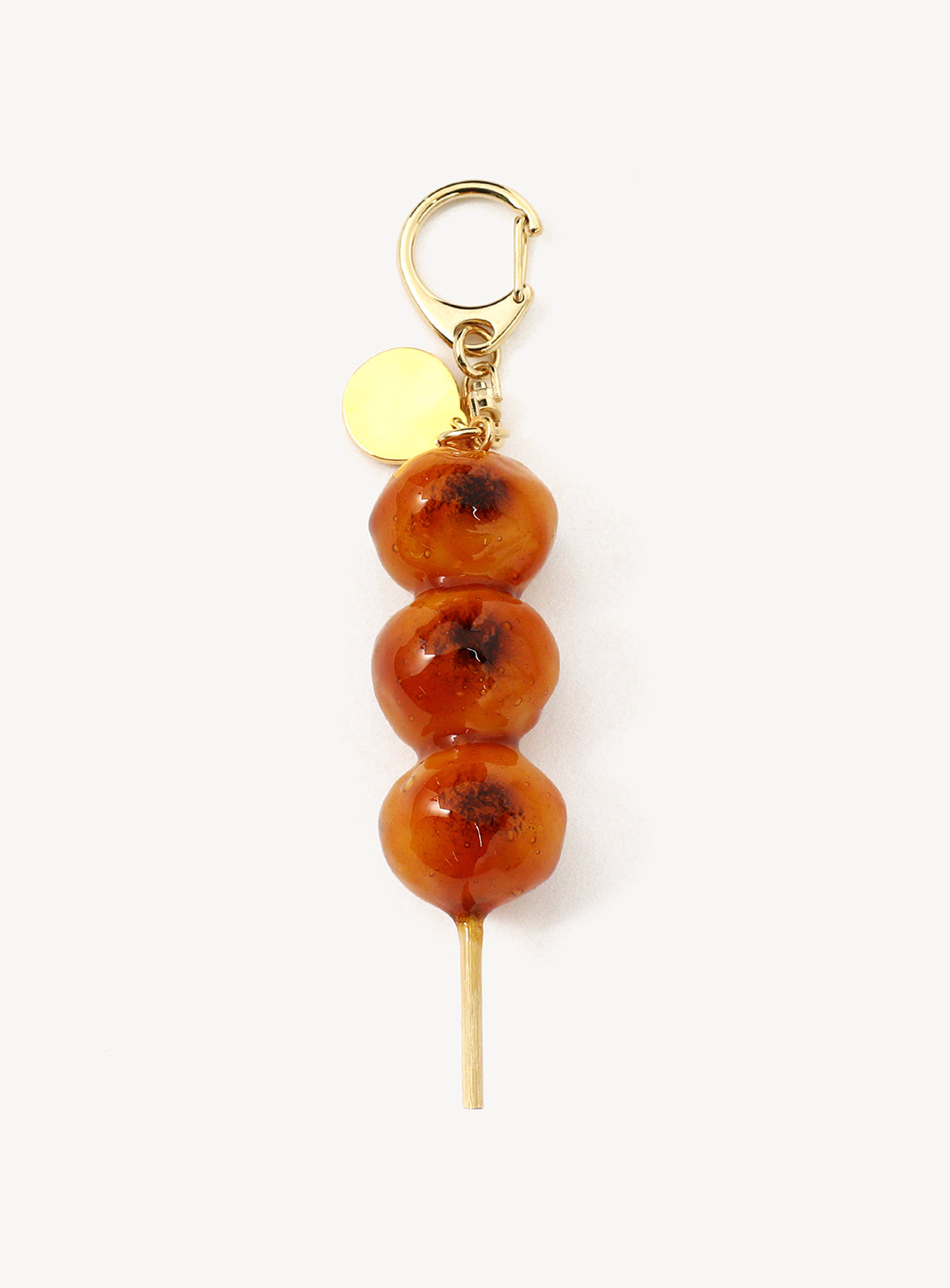 Keychain and a gold clasp against a white background