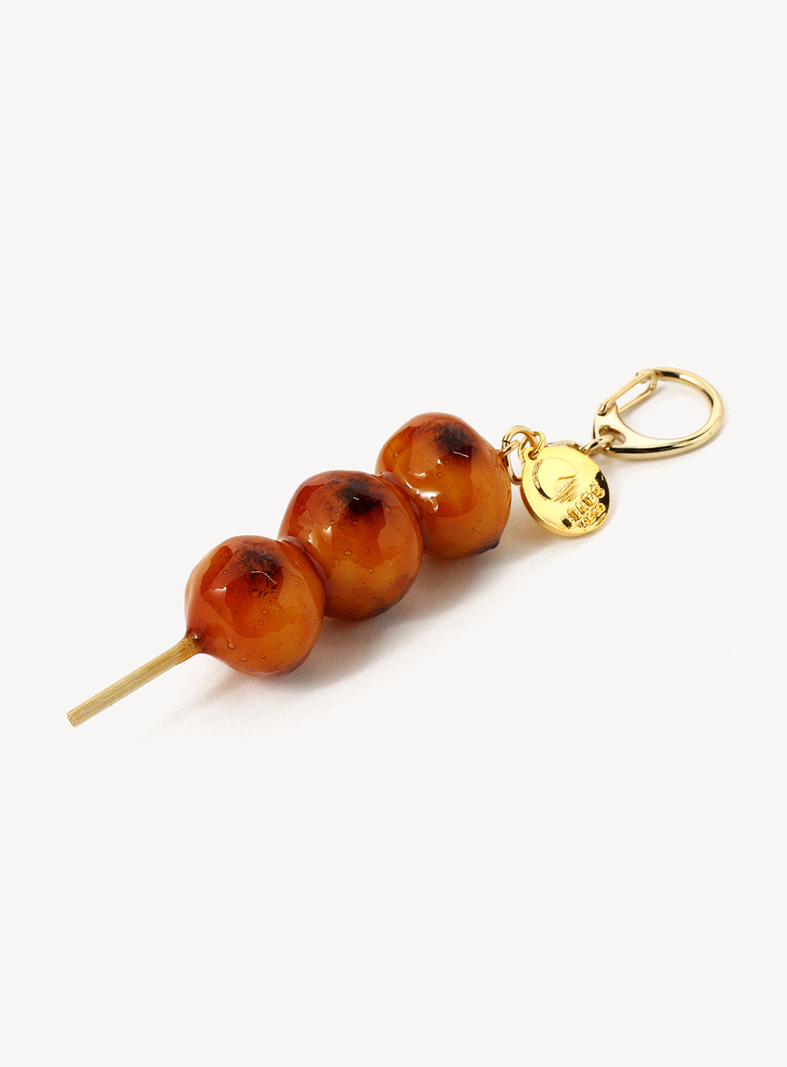 Keychain and a gold clasp against a white background