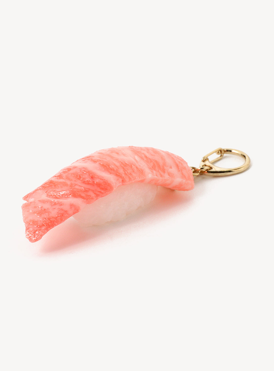 Sushi-shaped keychain on a white background