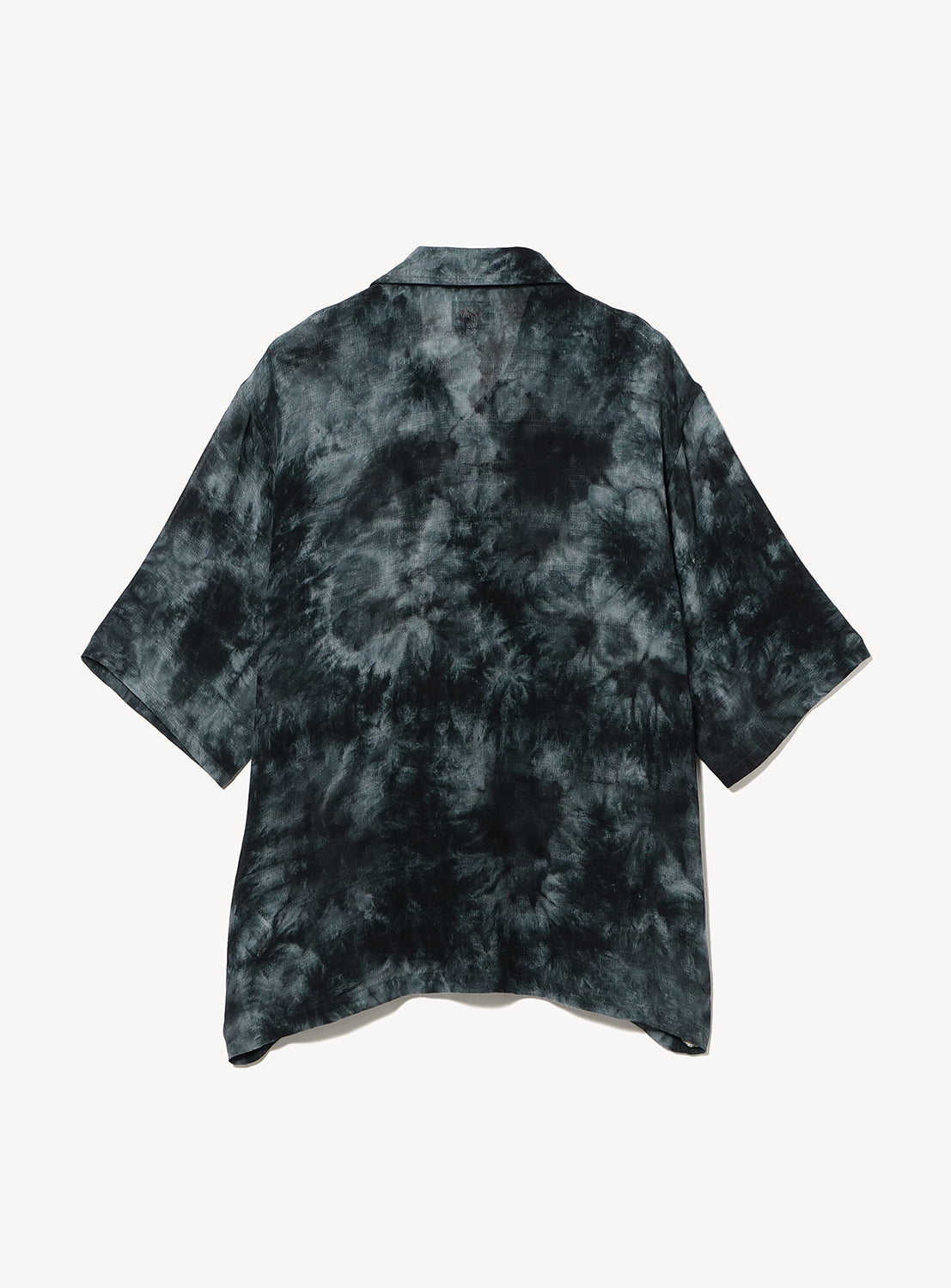 Back view of a short-sleeve open-collar shirt showcasing the all-over charcoal and black tie-dye pattern. The relaxed, boxy silhouette and clean back panel highlight the garment's fluid drape and distinctive dye variations.