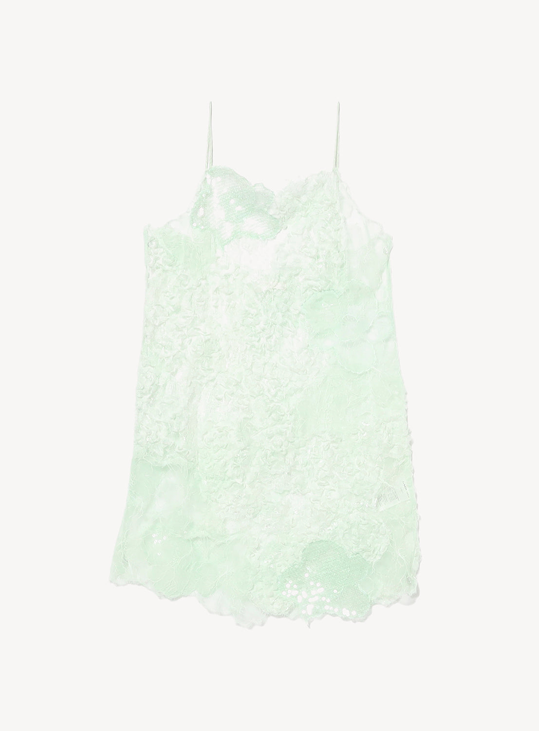 The KANAKO SAKAI Lace Patchwork Mini Dress is a light green mini slip dress featuring thin spaghetti straps, mesh and lace patchwork, and delicate floral lace detailing, presented against a white background.
