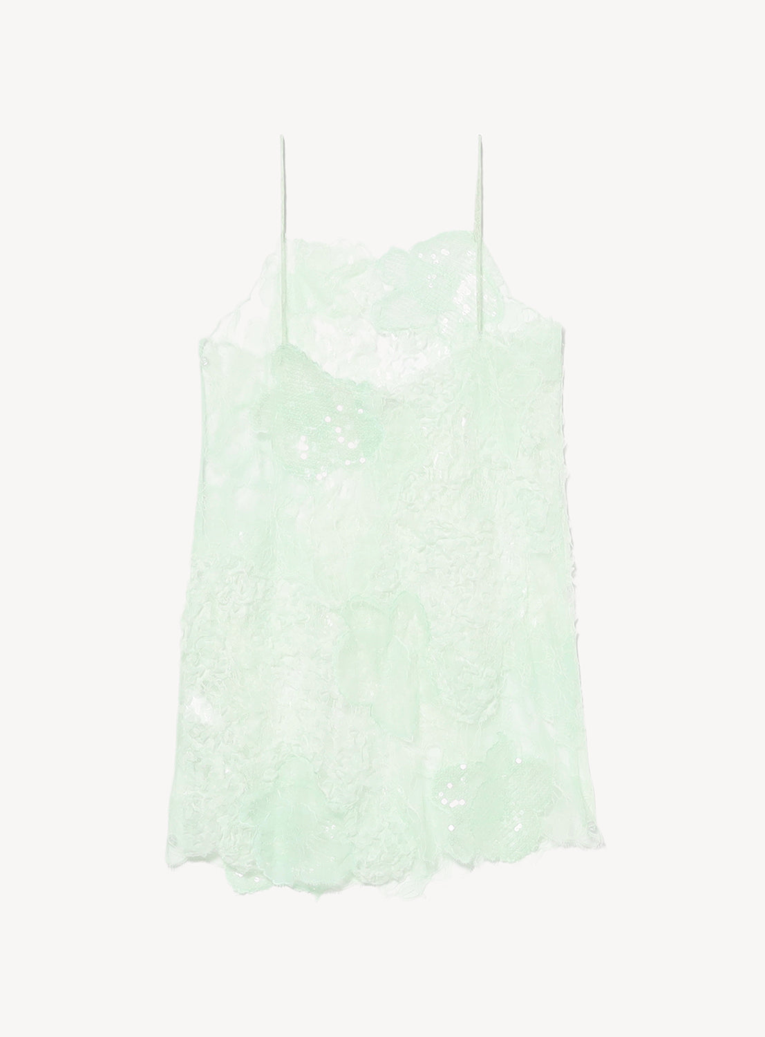 A light mint green Lace Patchwork Mini Dress by KANAKO SAKAI, featuring thin spaghetti straps, a delicate floral lace pattern, and a slightly sheer lace and mesh design, displayed against a plain white background.