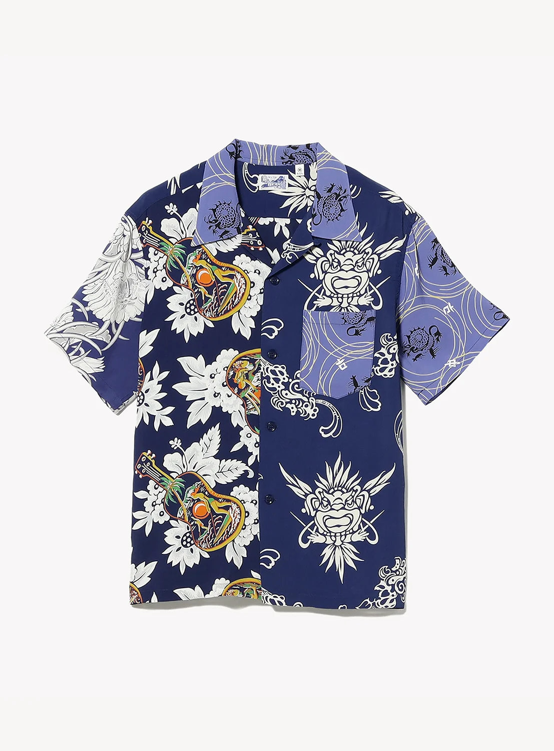 Short-sleeve button-up shirt with navy and blue panels, featuring bold white floral and intricate lion face designs, colorful masks, and swirling line patterns.