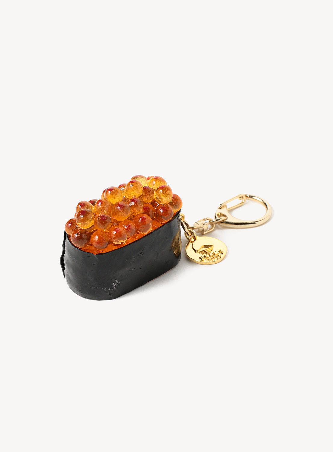 Sushi-shaped keychain with gold clasp on a white background