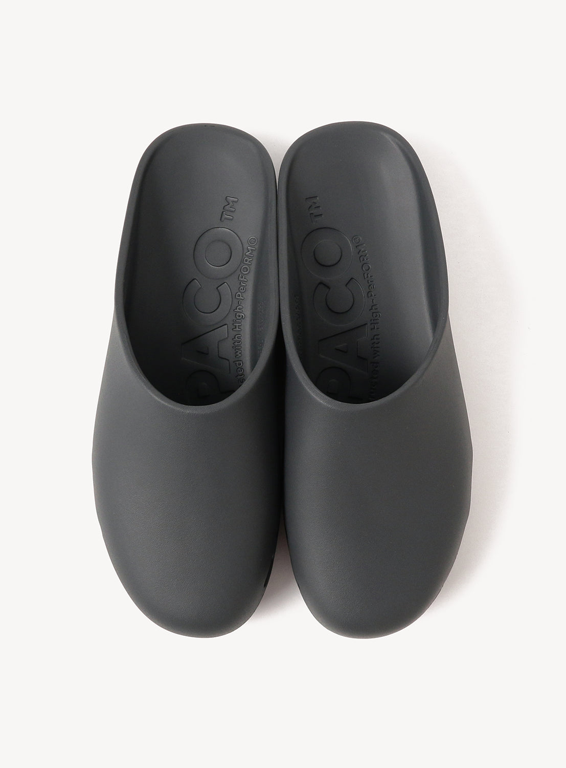 A pair of black LUX-1 Closed-Toe Slide Sandals by PPACO with a smooth texture, shown from above on a white background. Cushioned insoles offer all-day comfort and feature the PPACO branding.