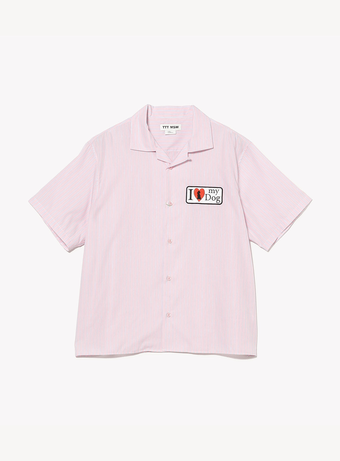 The TTT MSW "I Love My Dog Half Sleeve Shirt" is a light pink, short-sleeve, button-up shirt with a modern silhouette and relaxed fit. It features a classic collar and a patch on the left chest that reads "I ❤️ my Dog," showcased against a plain white background.
