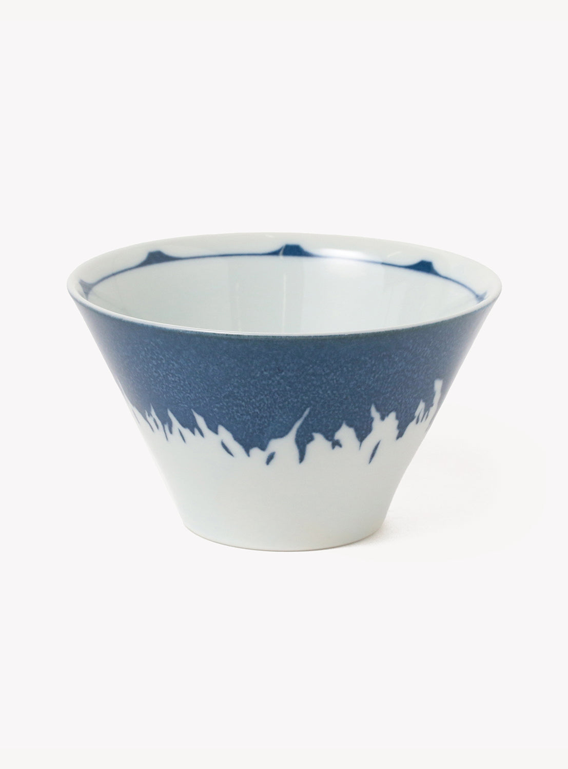 Ceramic bowl with blue and white design on a white background