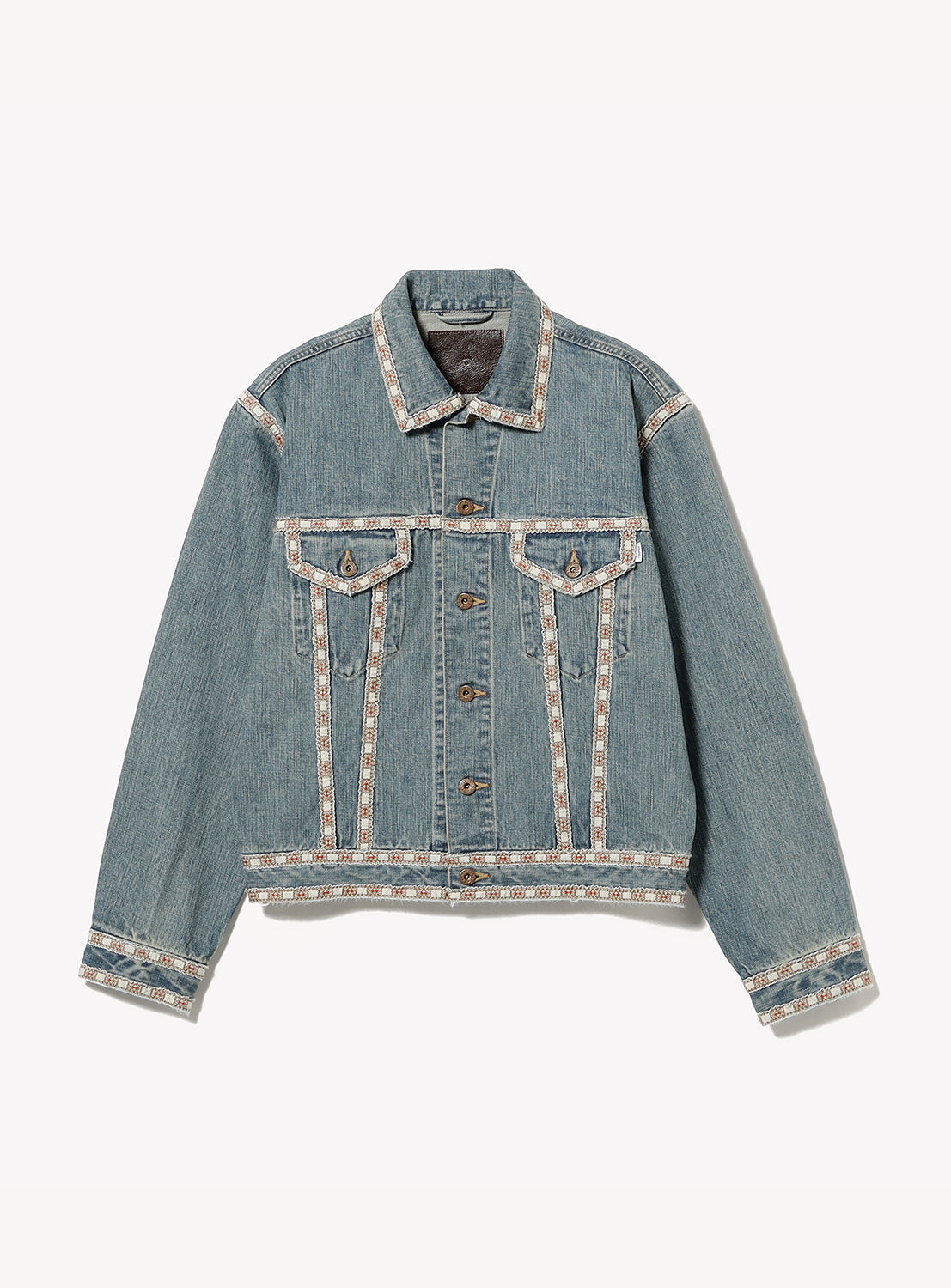 The SUGARHILL Faded Tyrol Denim Jacket is a light blue vintage-wash jacket with decorative trim on the collar, seams, cuffs, and hem. It features button closures, two flap chest pockets, and has a relaxed fit.