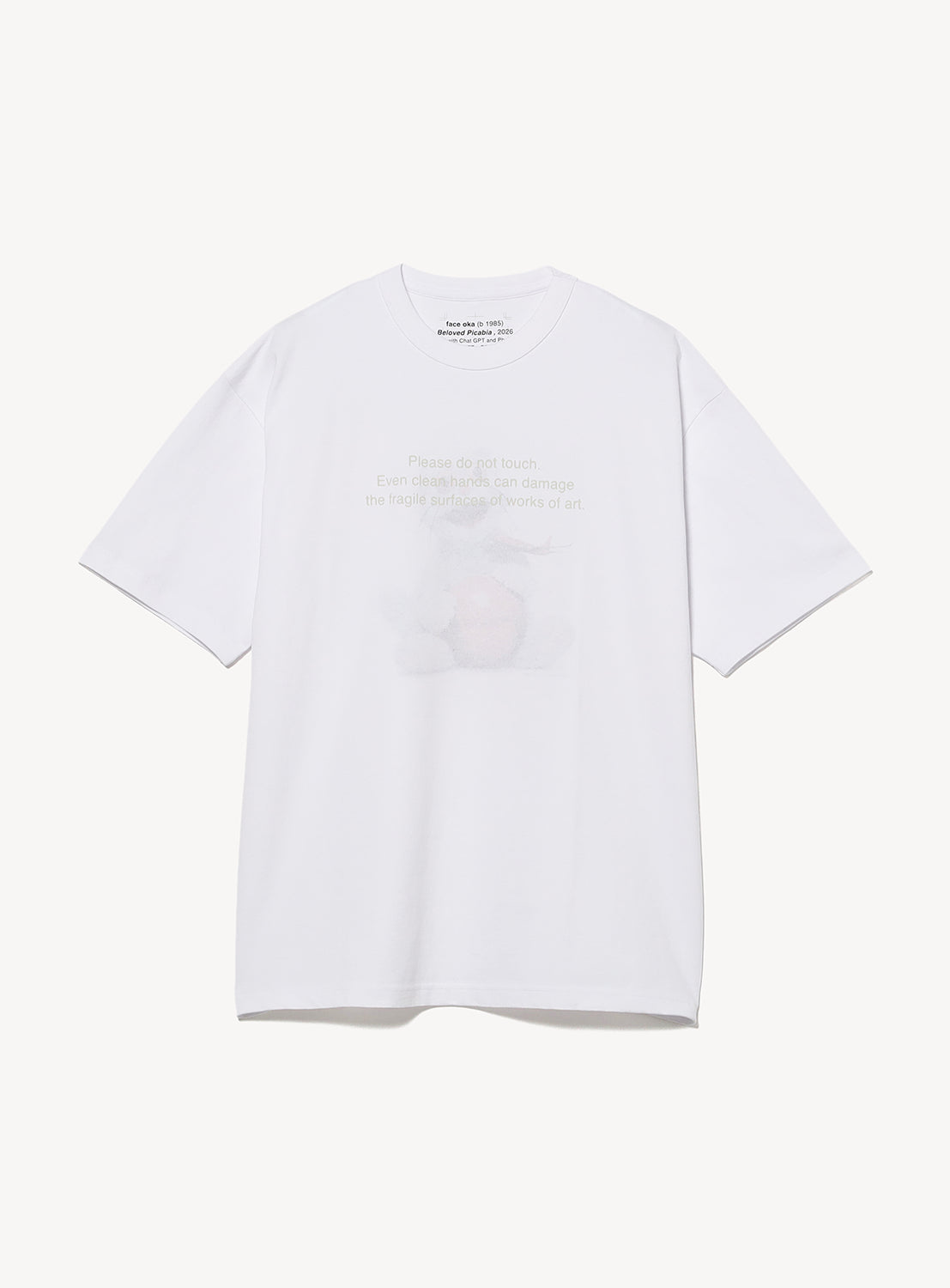 A relaxed-fit FACE Graphic T-Shirt by BEAMS T, in plain white with short sleeves, features a subtle front graphic. This special edition celebrates the BEAMS T 50th anniversary and is part of a collaboration with artist FACE.