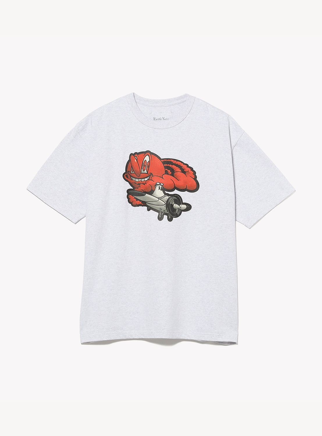 The BEAMS T 50th Anniversary x KOICHI YAIRI Graphic T-Shirt features red cartoon lizard artwork riding a silver airplane, printed on light gray and created with GALLERY TARGET.