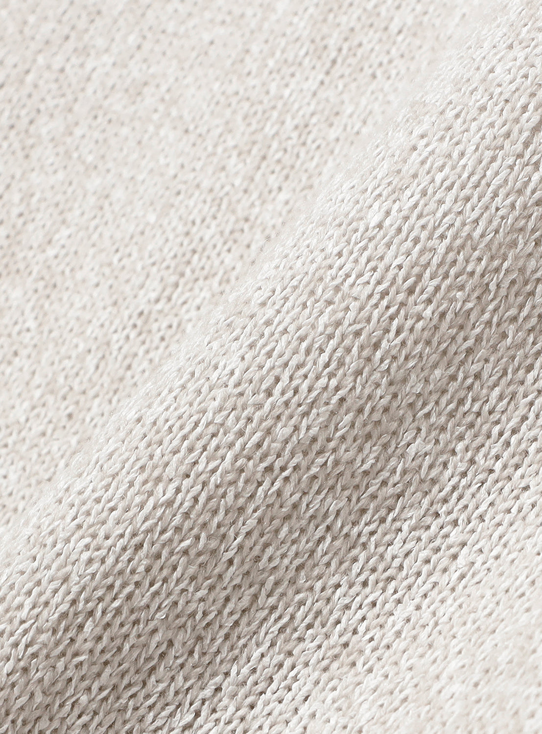 Close-up of a light beige 7-Gauge Washi Crew Neck Knit with a visible melange finish and texture.