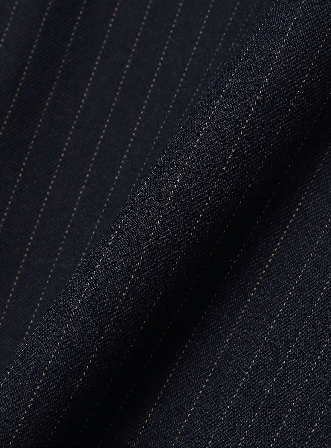 BEAMS Pattern 6-Pocket Pants in dark blue relaxed fit fabric with thin, vertical pinstripes and adjustable hems.