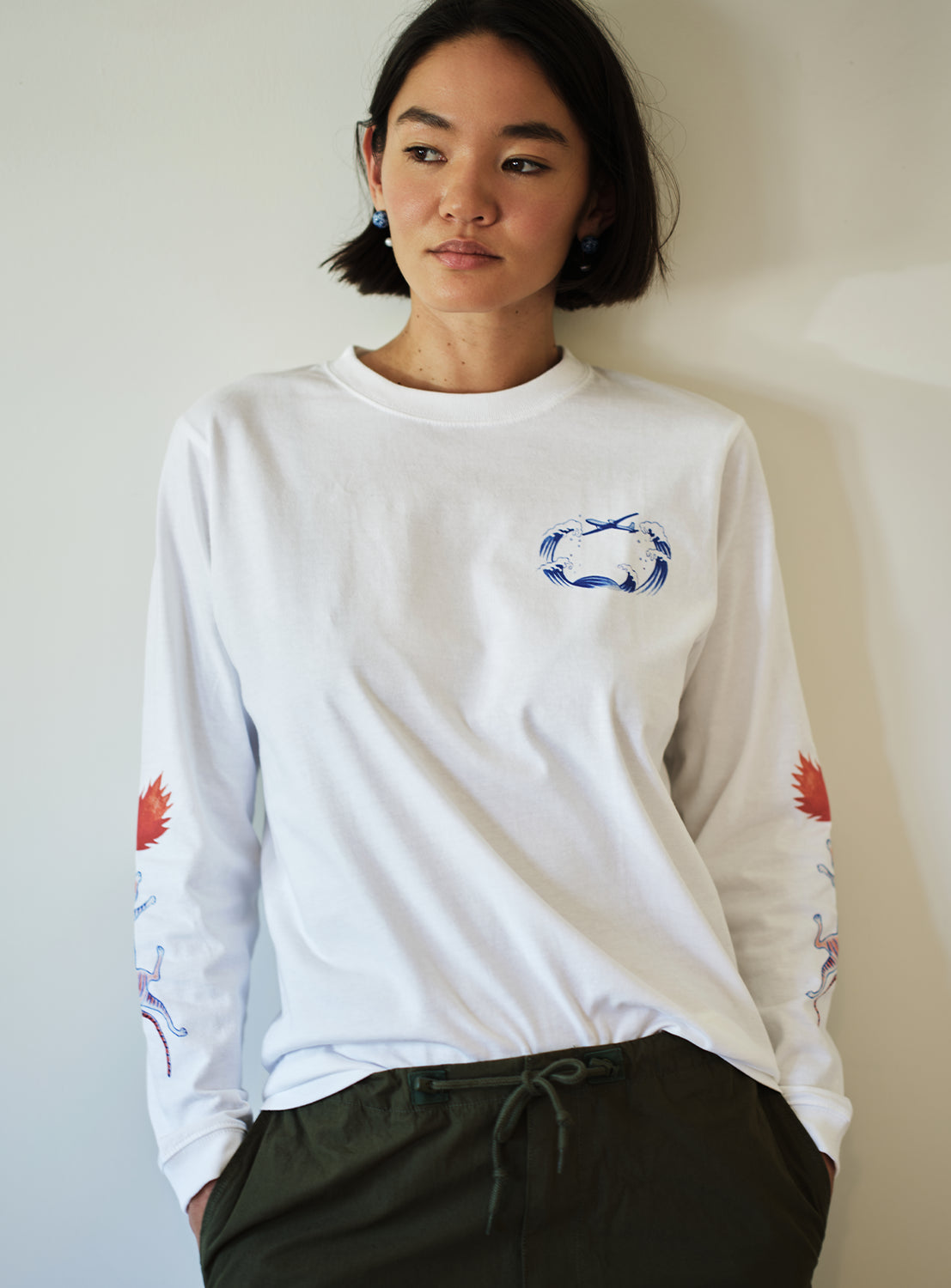 Model wearing a Tadanori Yokoo long-sleeve tee, fit of the shirt.