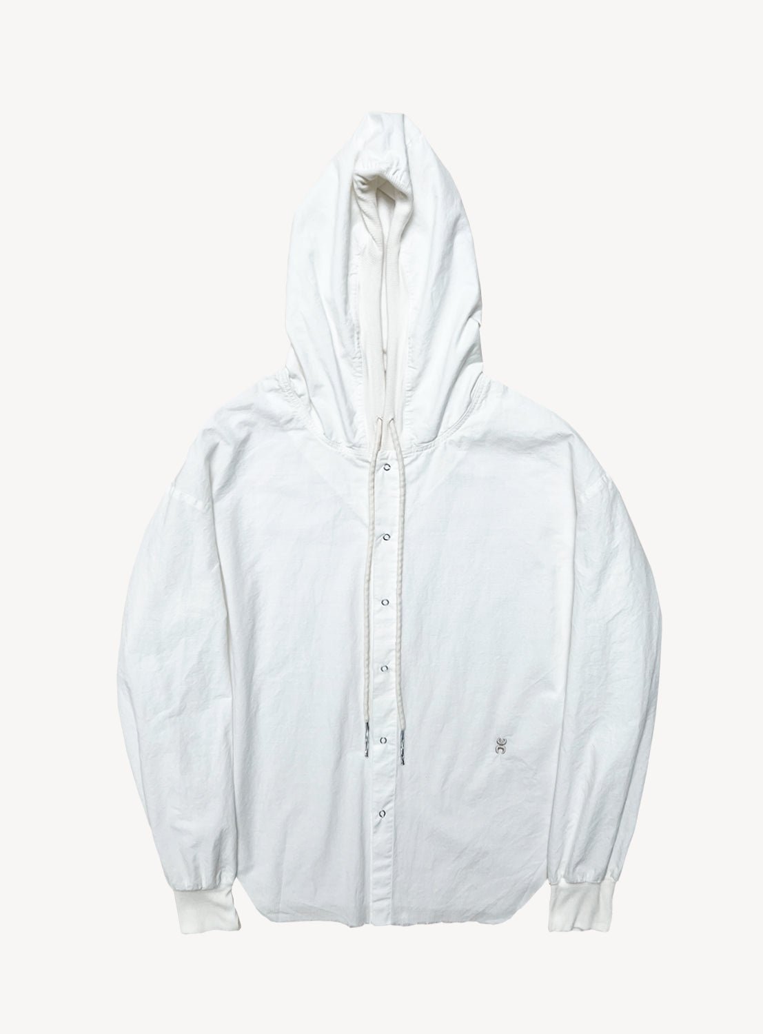 The VIAPIAVE33 Cloud Hoodie Shirt is a lightweight, white hooded jacket with a relaxed fit, snap button front closure, long sleeves, ribbed cuffs, and an adjustable drawstring hood. The jacket is displayed laid flat against a white background.